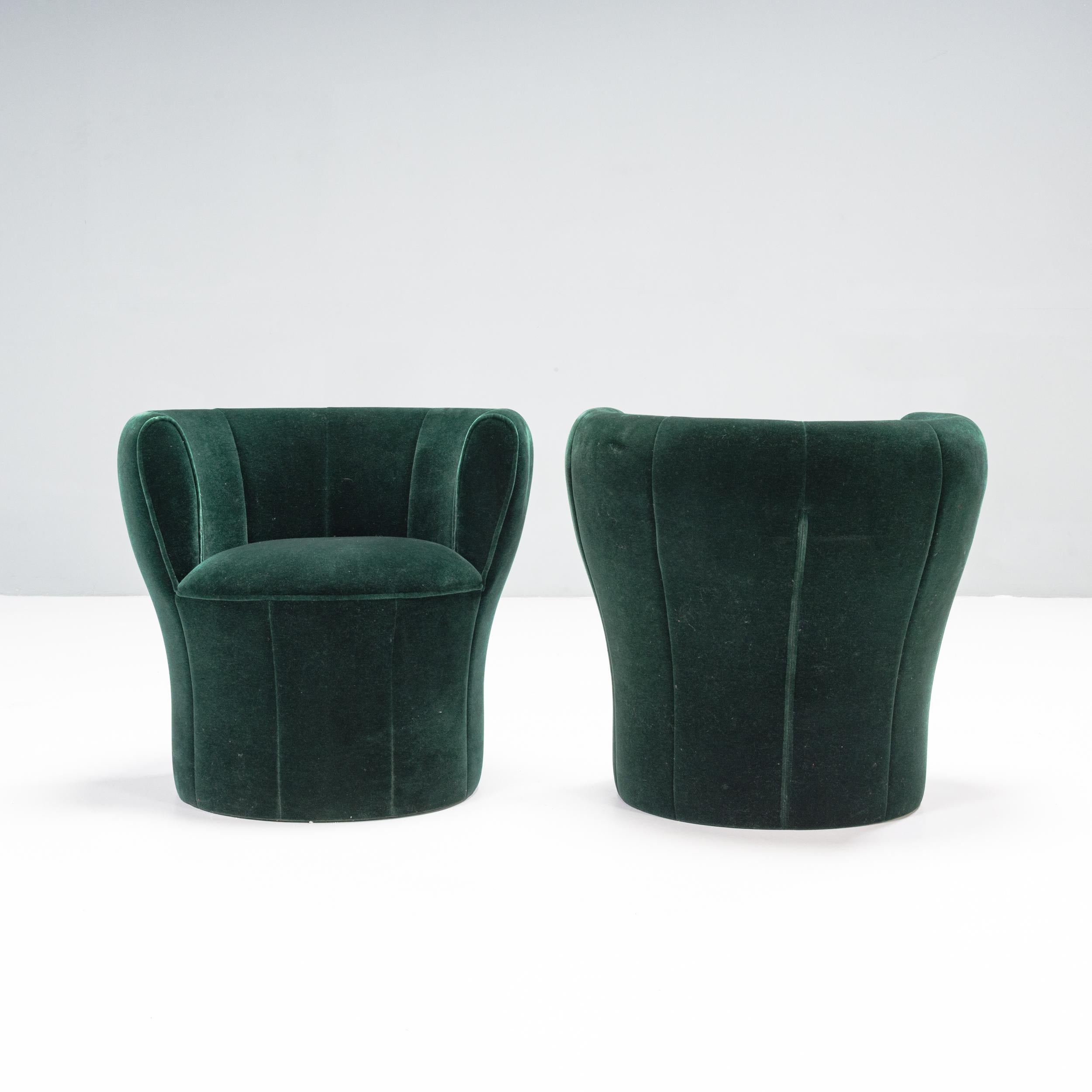 Designed by Laudani & Romanelli for Driade, the Lisa chair is a modern take on the classic club chair.

Designed with a circular shape, the backrest follows the curve of the chair to create a cocooned feel.

Fully upholstered in emerald green