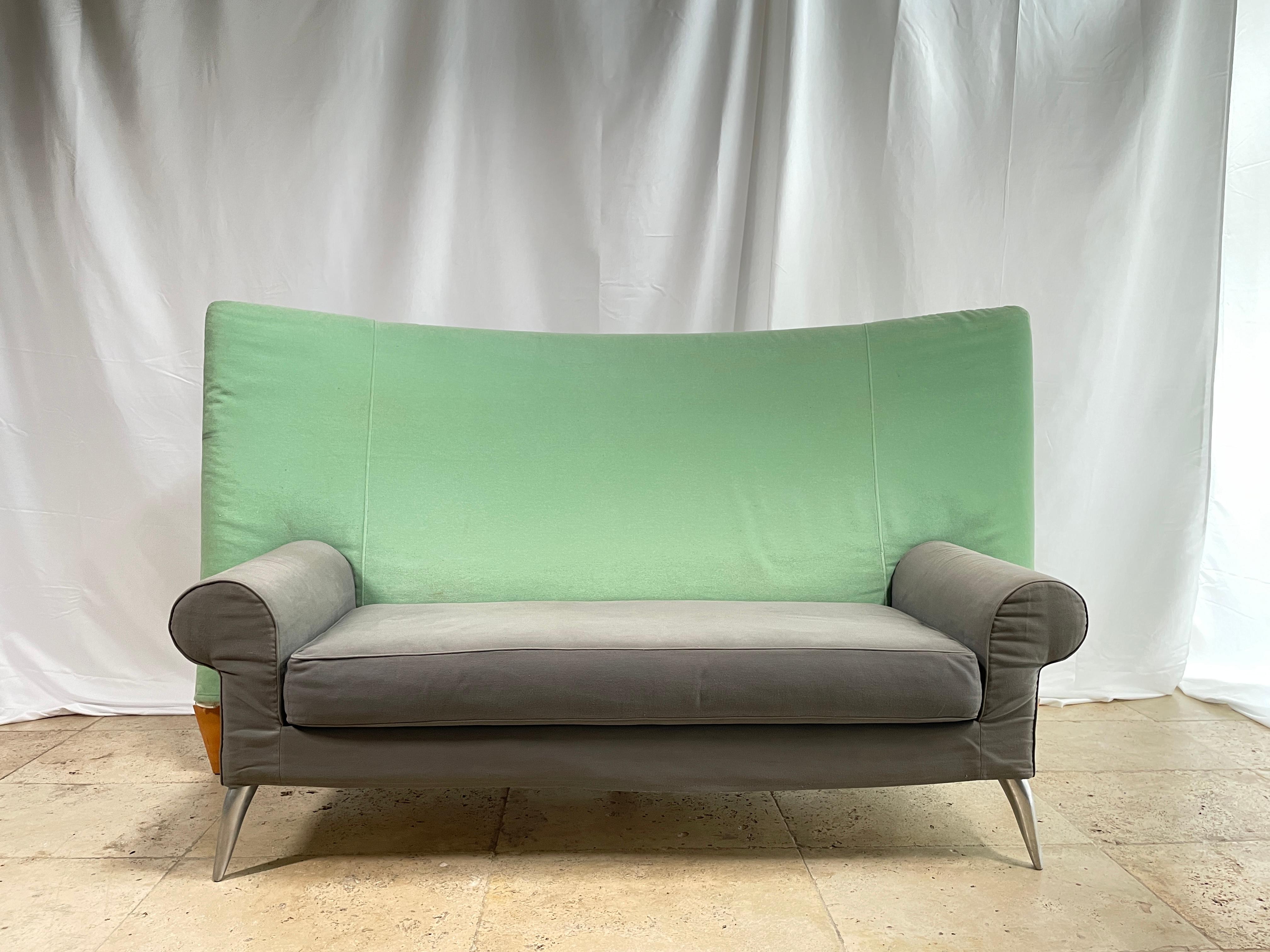 Philippe Starck (born 1949)
 Royalton model sofa with legs in polished aluminium cast iron at the front and solid beech at the back. Steel frame with foam covered in green and grey cotton canvas.
 Edition: Driade, circa 1988.
 A few traces of use