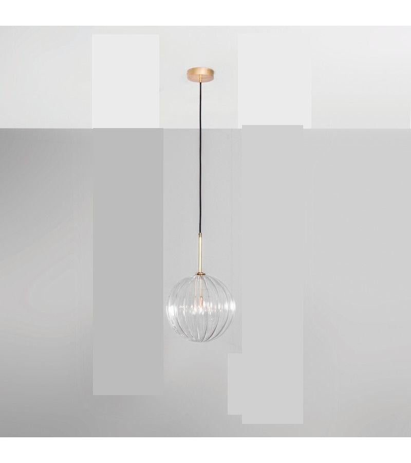 Contemporary globe chandelier 30 by Schwung
Dimensions: D 30 x W 30 x H 352 cm 
Materials: Solid brass, hand-blown glass textured globes.
Finish: Natural brass. 
Available in finishes: Polished nickel or black gunmetal. Also available in other