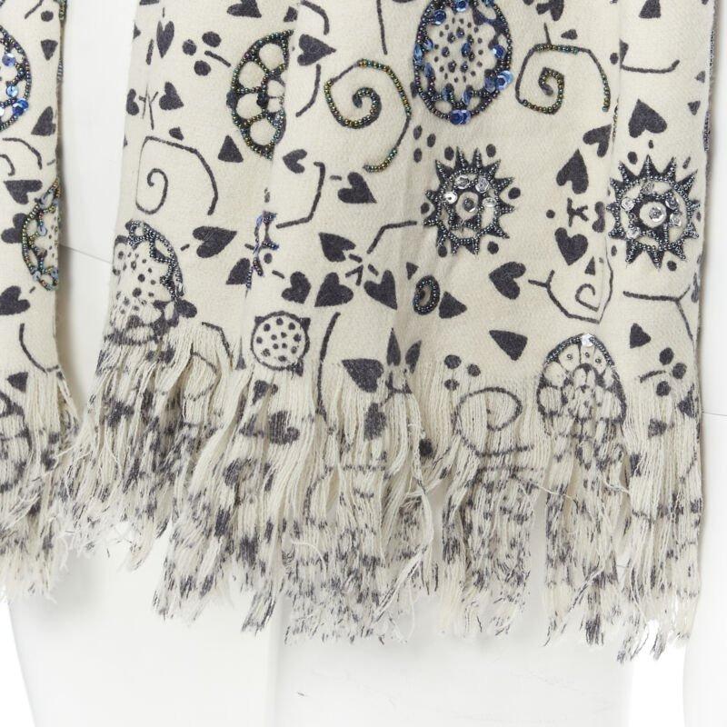 DRIES VAN NOTEN 100% wool illustration print bead embellished frayed scarf
Reference: AEMA/A00017
Brand: Dries Van Noten
Material: Wool
Color: Beige, Navy
Pattern: Abstract
Extra Details: Bead embellishment. Frayed ends.
Made in: