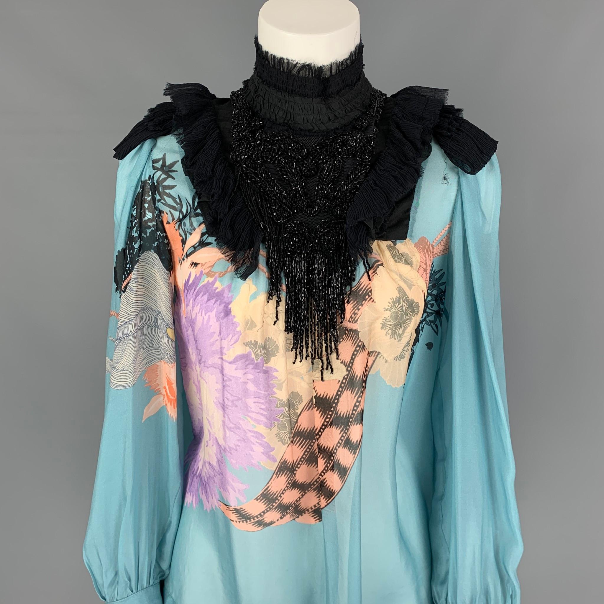 DRIES VAN NOTEN blouse comes in a blue & black print silk with a front beaded fringe design featuring a mock neck, long sleeves, and a back buttoned closure. 

Very Good Pre-Owned Condition.
Marked: 36

Measurements:

Shoulder: 12 in.
Bust: 36