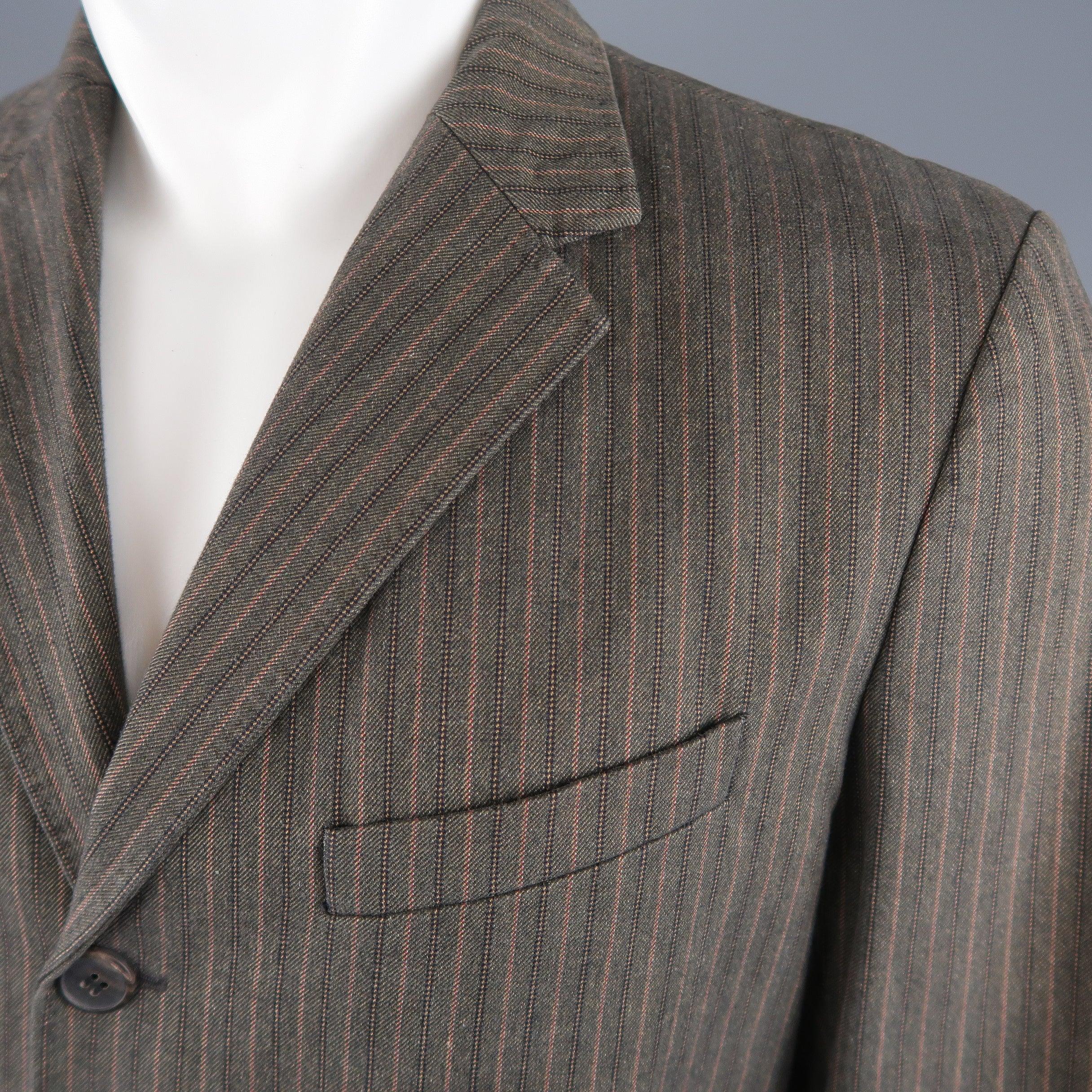 DRIES VAN NOTEN sport coat comes in taupe brown striped herringbone cotton with a notch lapel, three button single breasted front, and flap pockets. Made in Belgium.Excellent Pre-Owned Condition. 

Marked:   IT 48 

Measurements: 
 
Shoulder: 18