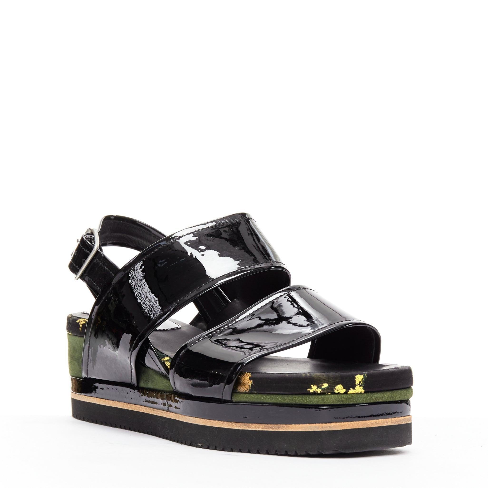 DRIES VAN NOTEN balck patent floral broade green suede platform sandal EU36.5
Reference: CELG/A00362
Brand: Dries Van Noten
Material: Patent Leather, Suede, Fabric
Color: Black, Green
Pattern: Floral
Closure: Buckle
Extra Details: Black patent