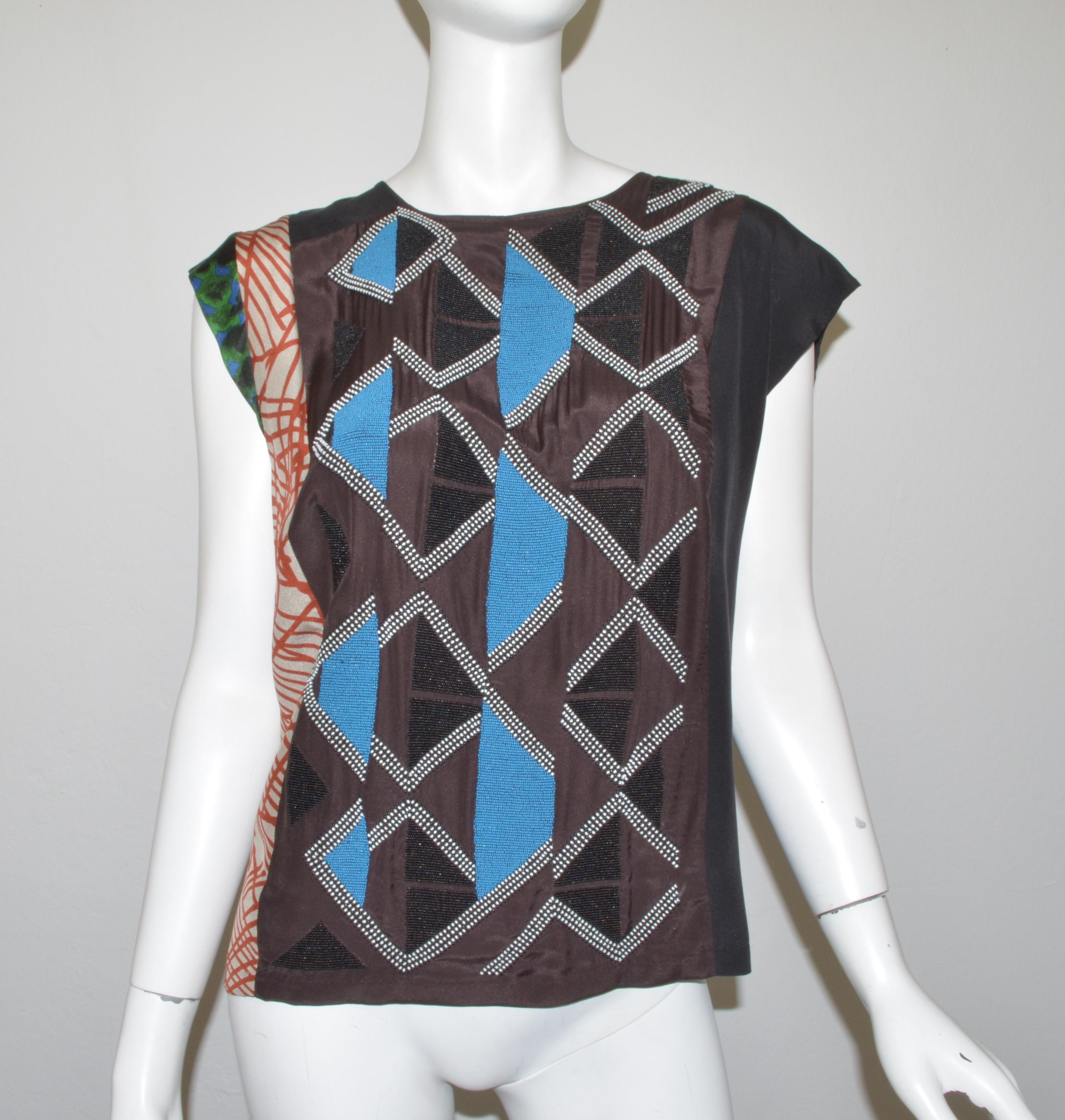 Dries Van Noten Bead-Embellished Printed Blouse -- featured a mixed print with bead embellishing and a single back snap fastening. Labeled size 40, 100% silk, made in India. Top is in good condition with some pulling to the fabric near the back snap