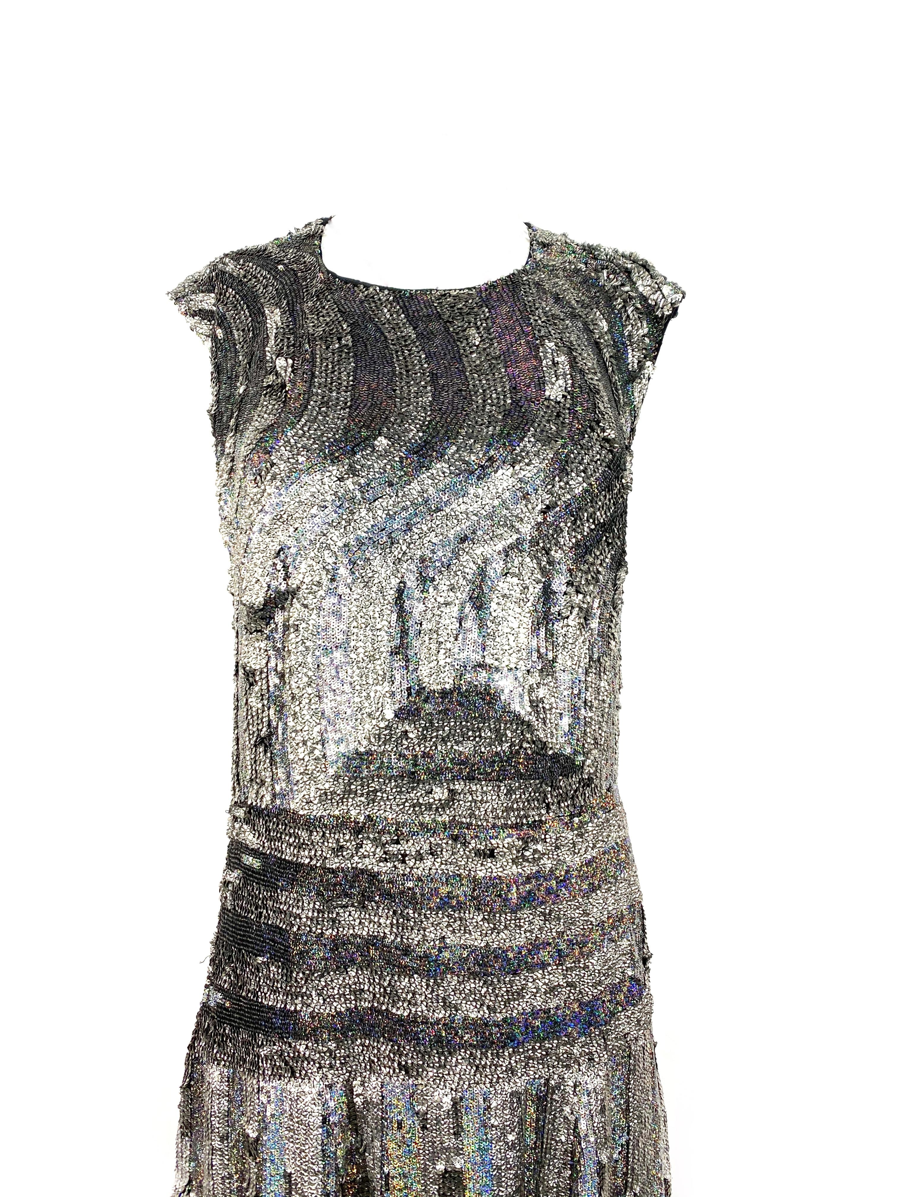 Dries Van Note Black and Grey Metallic Sequin Evening Dress Size 42

Product details:
Size 42
Sleeveless and midi length
Featuring striped pattern design
Rear zip and hook closure
