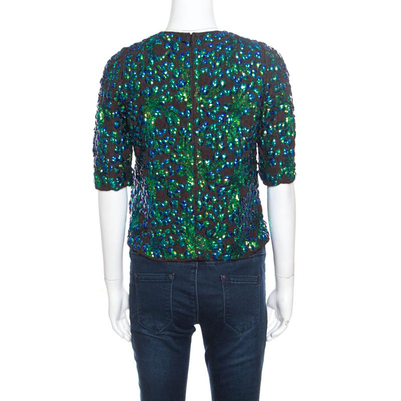 Every lady must have at least one crop top in her closet because they come in handy especially with high waist pants and skirts. This piece is from Dries Van Noten, made with a mix of fabrics to give you comfort. It has short sleeves and sequin