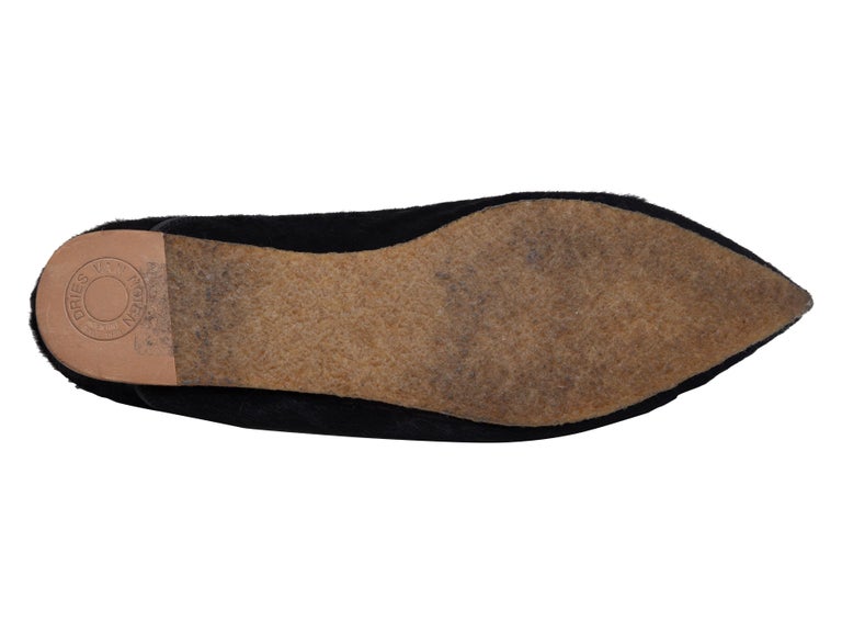 Product Details: Black pointed-toe ponyhair loafers by Dries Van Noten. 0.5
