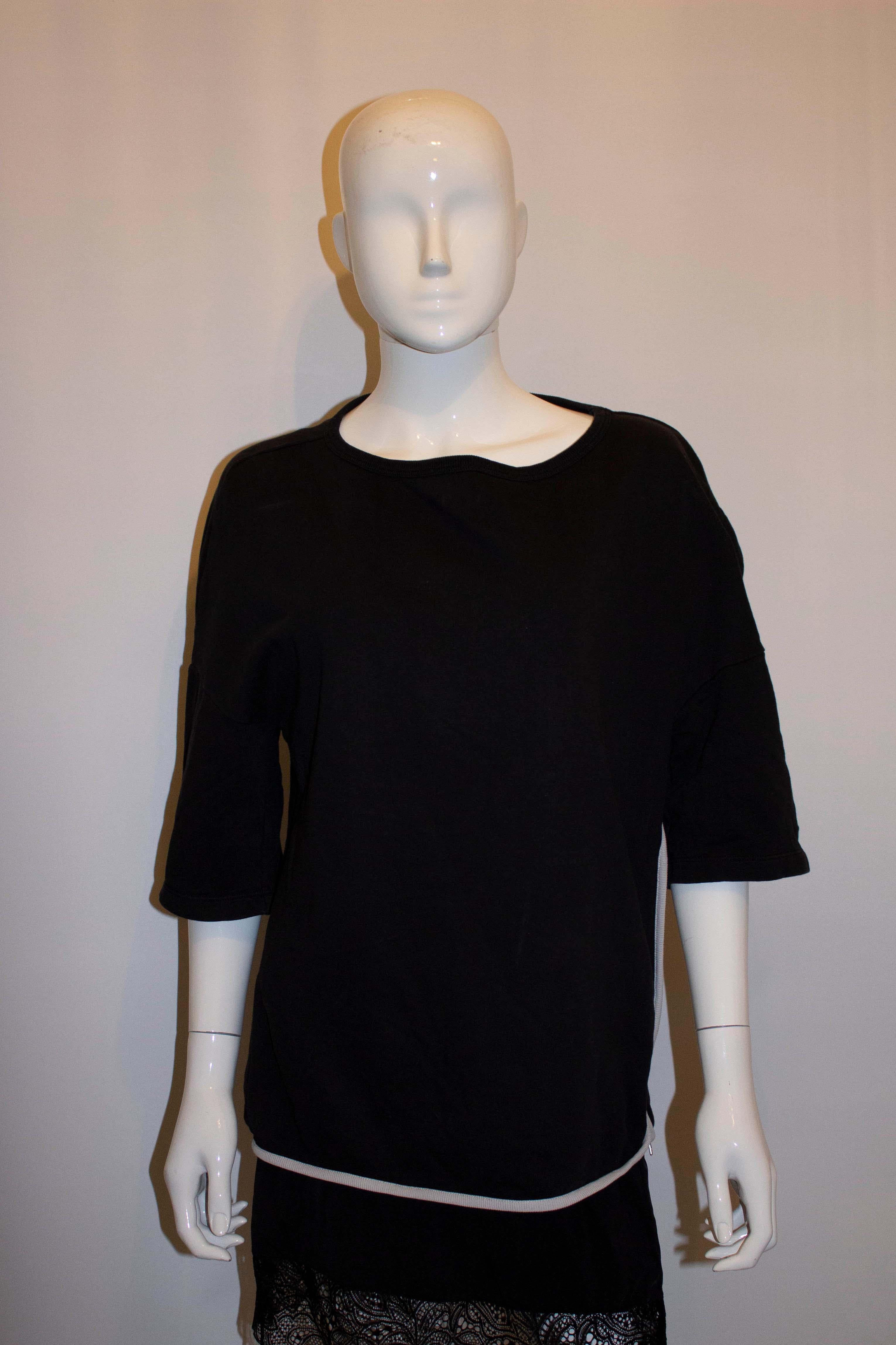 black shirt with white trim