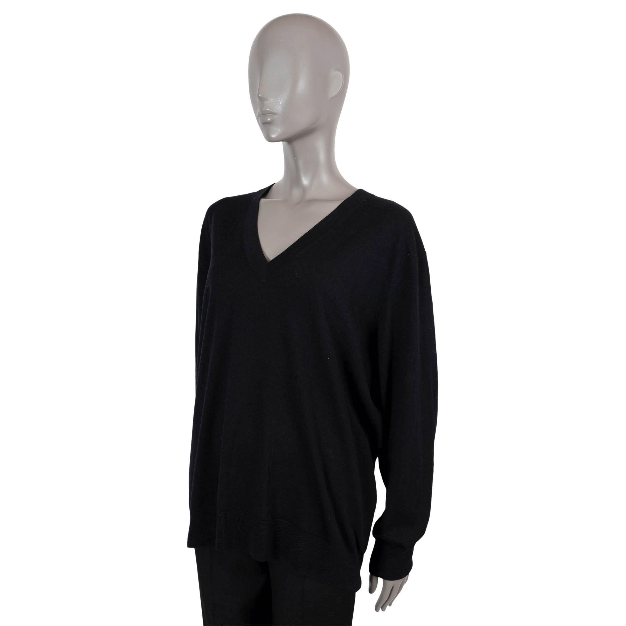 100% authentic Dries van Noten Tuna sweater in black merino wool (100%). Features V-neck and rib-knit cuffs and hem. Has been worn and is in excellent condition.

Measurements
Tag Size	Large
Size	L
Shoulder Width	52cm (20.3in)
Bust From	124cm