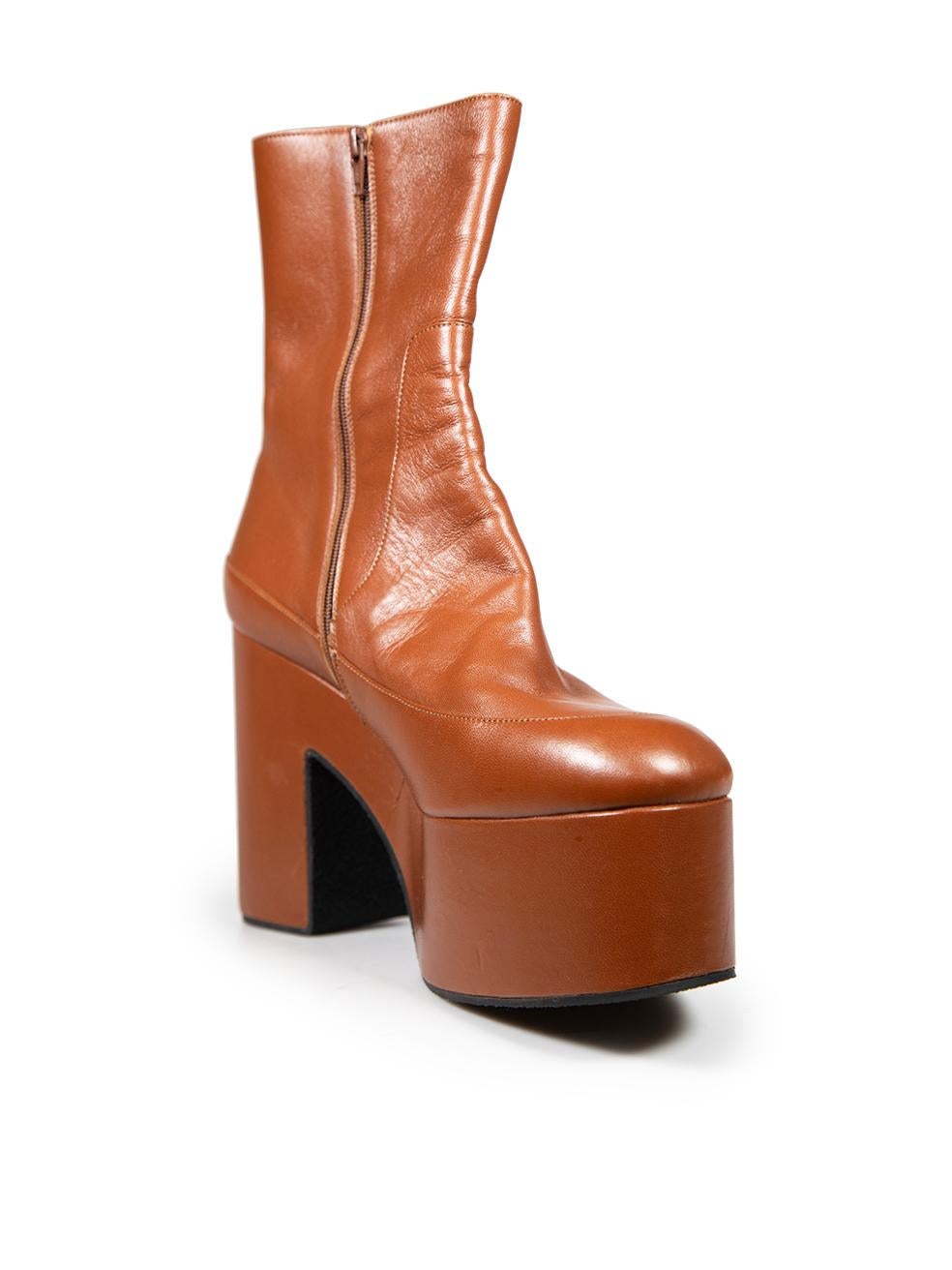 CONDITION is Very good. Minimal wear to the boots is evident. Abrasion across the platform, heel, toe cap and upper of both shoes on this used Dries Van Noten designer resale item.
 
 
 
 Details
 
 
 Brown
 
 Leather
 
 Boots
 
 Ankle length
 
