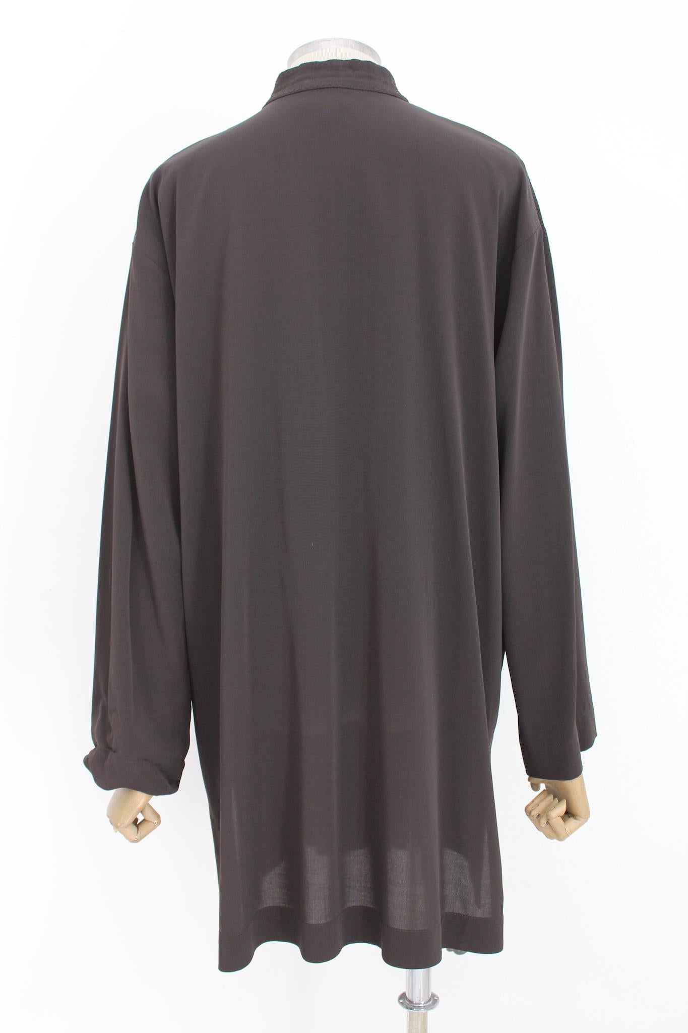 Long oversized shirt dress by Dries Van Noten. Dark brown color, button closure, 62% rayon, 38% wool fabric. Made in Belgium.

Size: 42 It 8 Us 10 Uk

Shoulder: 50 cm
Bust / Chest: 60 cm
Sleeve: 60 cm
Length: 92 cm