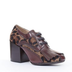 DRIES VAN NOTEN calf hair lace up brown leopard print fringe kiltie pumps EU37