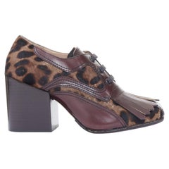 DRIES VAN NOTEN calf hair lace up brown leopard print fringe kiltie pumps EU37