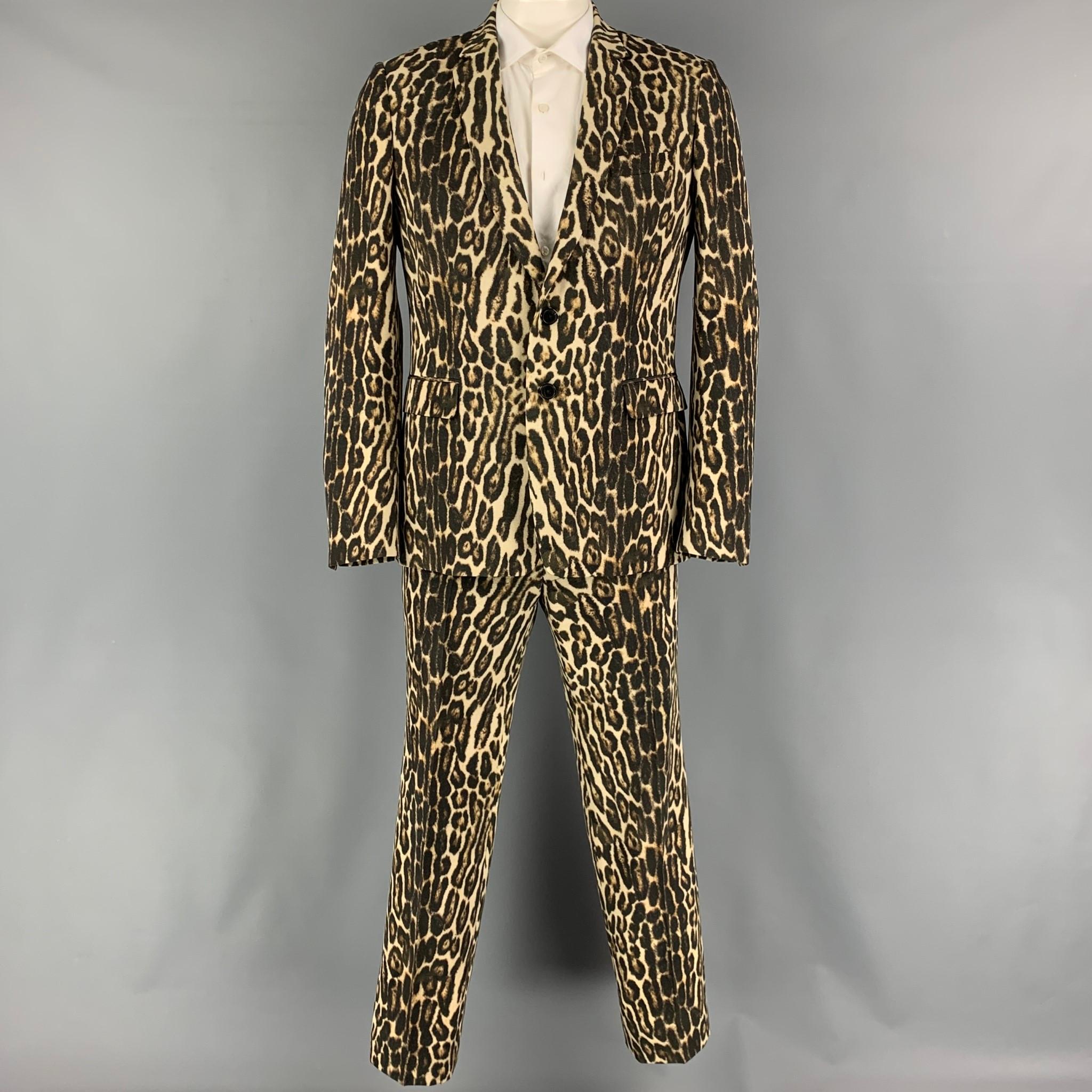 DRIES VAN NOTEN Spring-Summer 2020 suit comes in a brown and tan animal print wool woven material a full liner and includes a single breasted, double button sport coat with a notch lapel and matching flat front trousers.

Very Good Pre-Owned