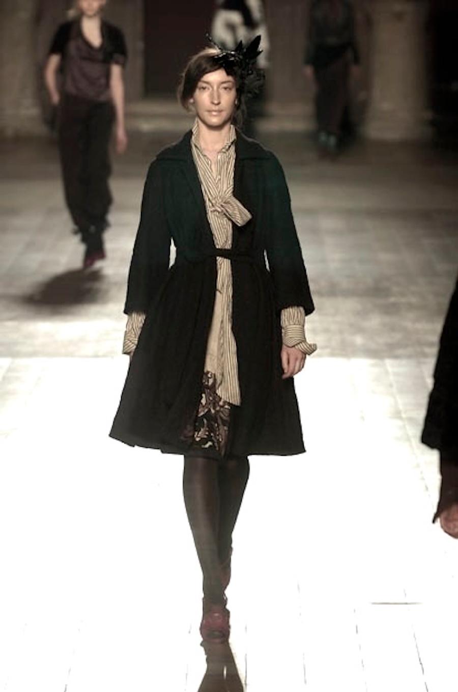 Totally fabulous vintage Dries Van Noten coat from the Fall 2005 collection. Classic and collectible. Made from thick wool and polyamide mix boucle with a super luxe green shantung silk lining. It has a super flattering flared swing cut with