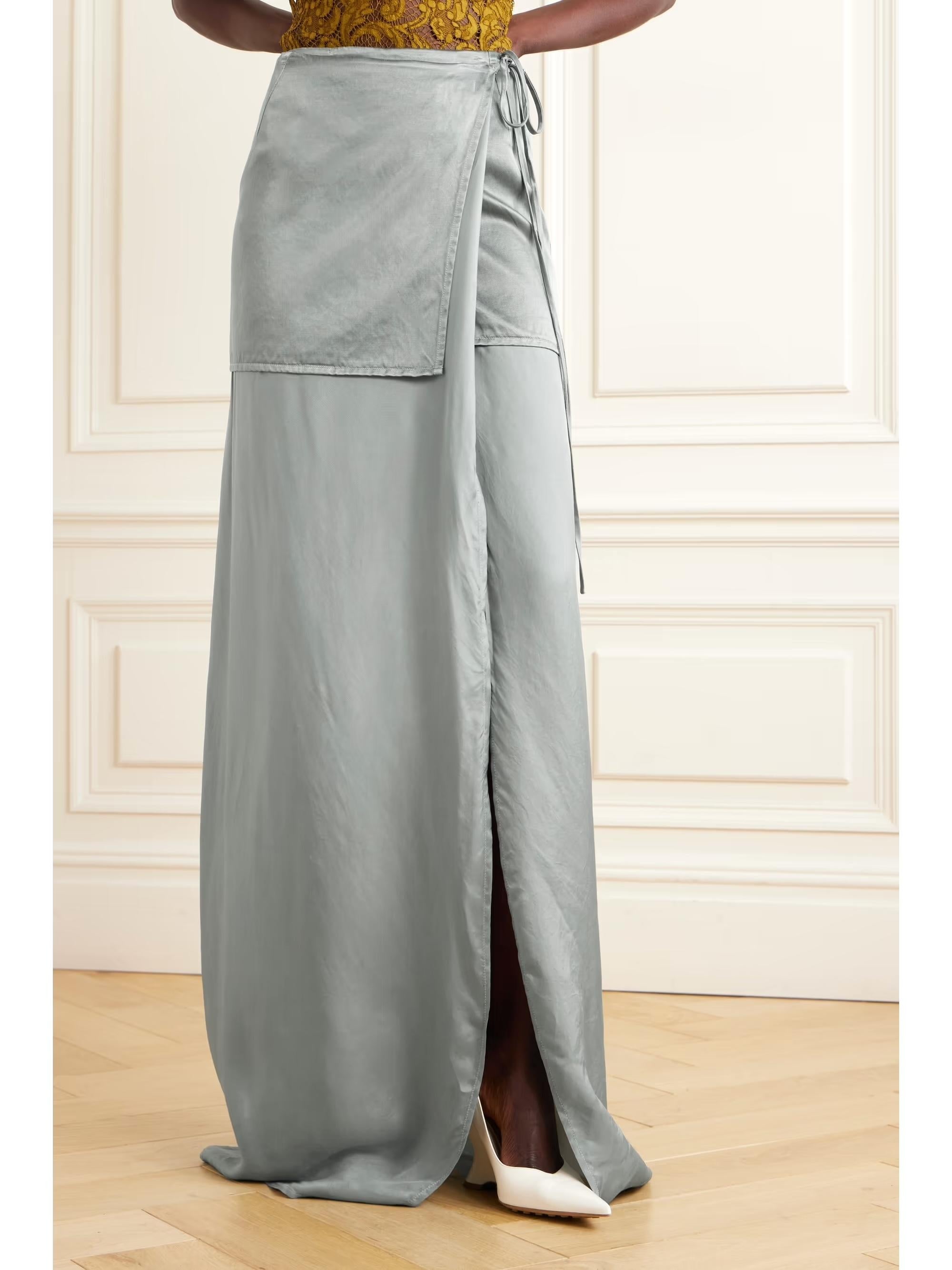 Minimalist boho Dries Van Noten layered maxi skirt from the Fall 2023 collection. Made from silvery grey two tone cupro mix satin (comp label has ben removed), it has been designed to look like a mini layered over a maxi. It has a wrap cut with