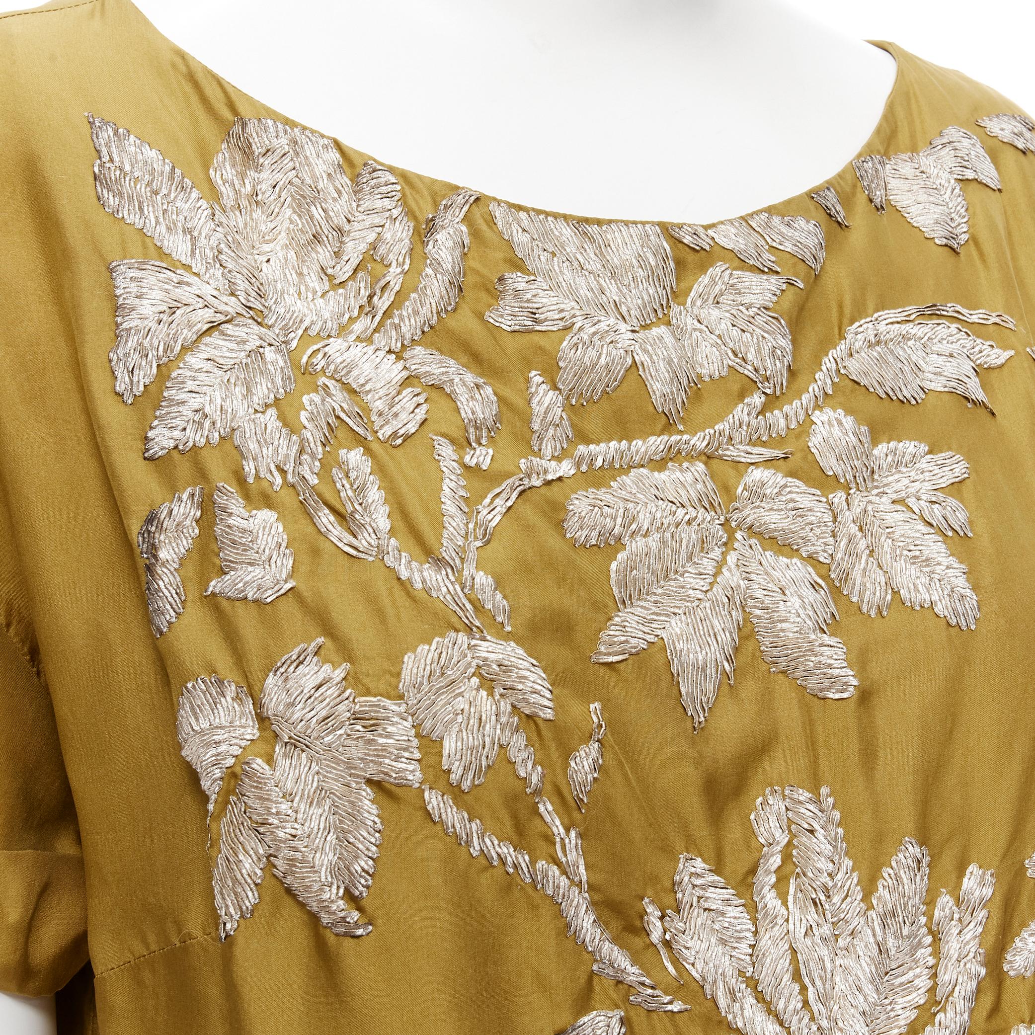DRIES VAN NOTEN gold black silk gold floral embroidery shift dress FR38 S 
Reference: CELG/A00201 
Brand: Dries Van Noten 
Designer: Dries Van Noten 
Material: Silk Color: Gold 
Pattern: Floral
Extra Detail: Gold-tone embroidery. Cuffed short