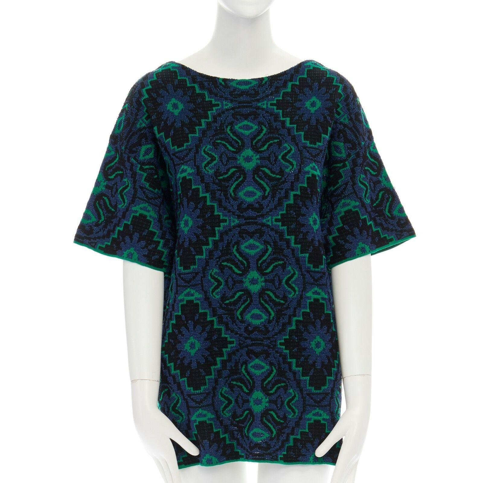 DRIES VAN NOTEN green blue ethnic jacquard knitted boxy short sleeve top M

DRIES VAN NOTEN
Cotton, polyester. Green, black and black ethnic jacquard. 
Stretch fit. Boxy fit top. 
Made in Belgium.

CONDITION
Very good, this item was pre-owned and is