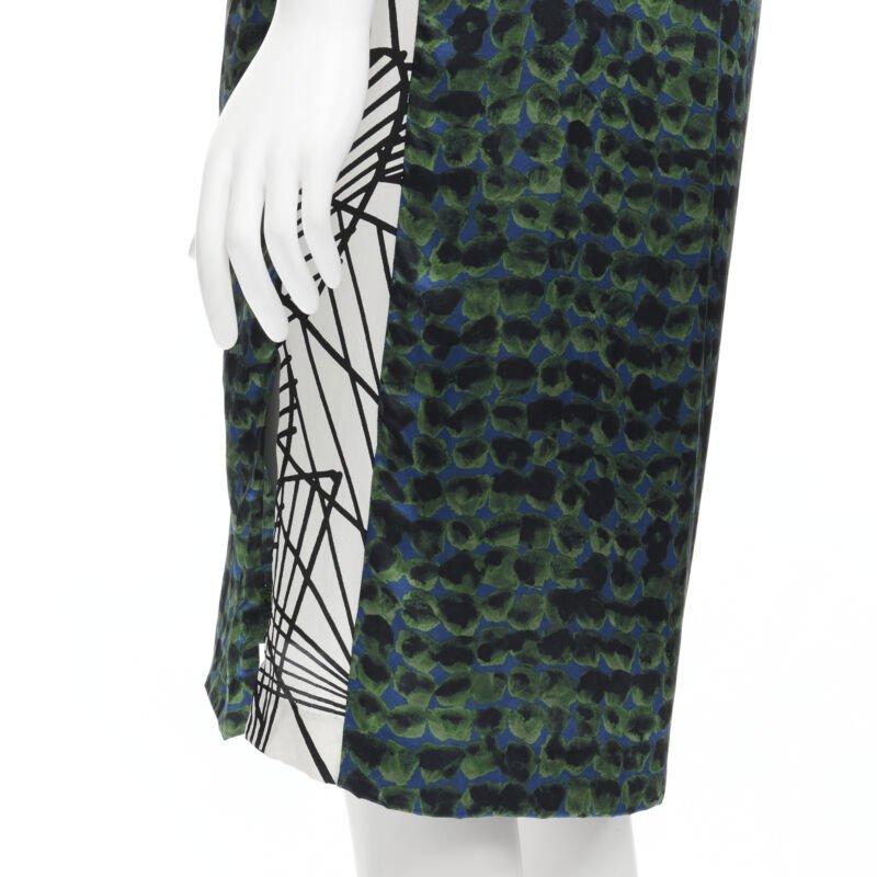 DRIES VAN NOTEN green navy draped silk contrast short sleeve dress FR36 S
Reference: CELG/A00111
Brand: Dries Van Noten
Material: Silk
Color: Green
Pattern: Abstract
Extra Details: Washed navy cotton shoulder epaulette sleeve. Draped neckline.