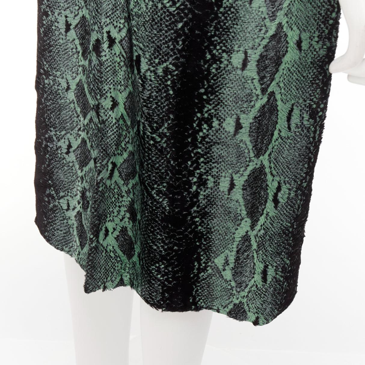 DRIES VAN NOTEN green painted snake print furry midi skirt FR36 S
Reference: DYTG/A00066
Brand: Dries Van Noten
Material: Viscose, Cotton
Color: Green, Black
Pattern: Animal Print
Closure: Zip
Lining: Black Fabric
Extra Details: Back zip. Slit at