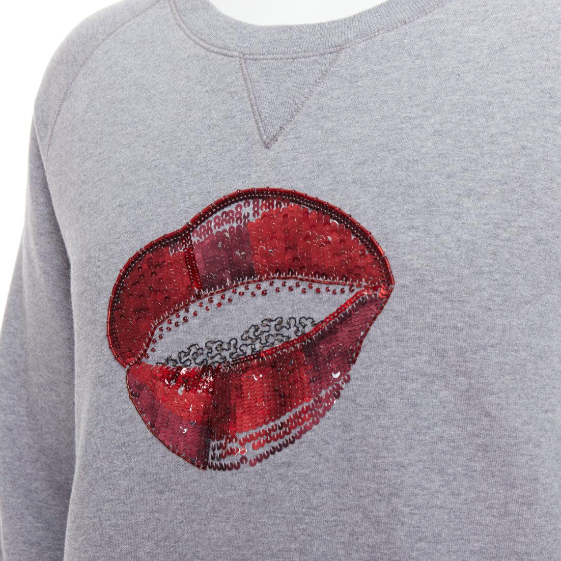 DRIES VAN NOTEN grey cotton red sequins lip crew pullover top L
Reference: PRCG/A00017
Brand: Dries Van Noten
Material: Cotton
Color: Grey, Red
Pattern: Sequins
Closure: Pullover
Made in: Turkey

CONDITION:
Condition: Excellent, this item was