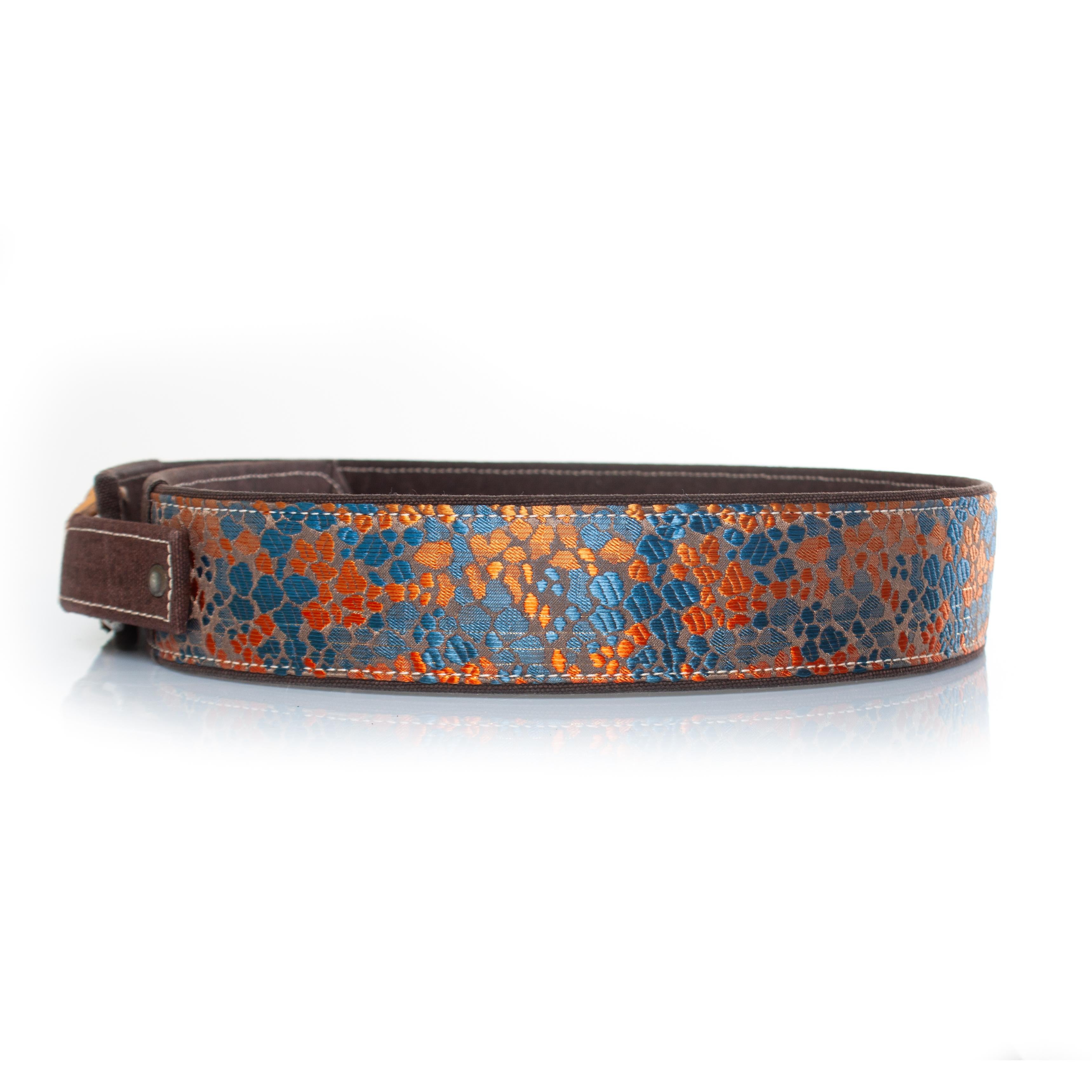 Dries van noten, jacquard woven belt in orange and blue. The item is in good condition. 

CONDITION: good condition

SIZE: 90

MEASUREMENTS: length 100 cm, width 5 cm

MATERIAL: cloth, leather, fabric

CARE: spot cleaning

COLOR: orange, brown, blue
