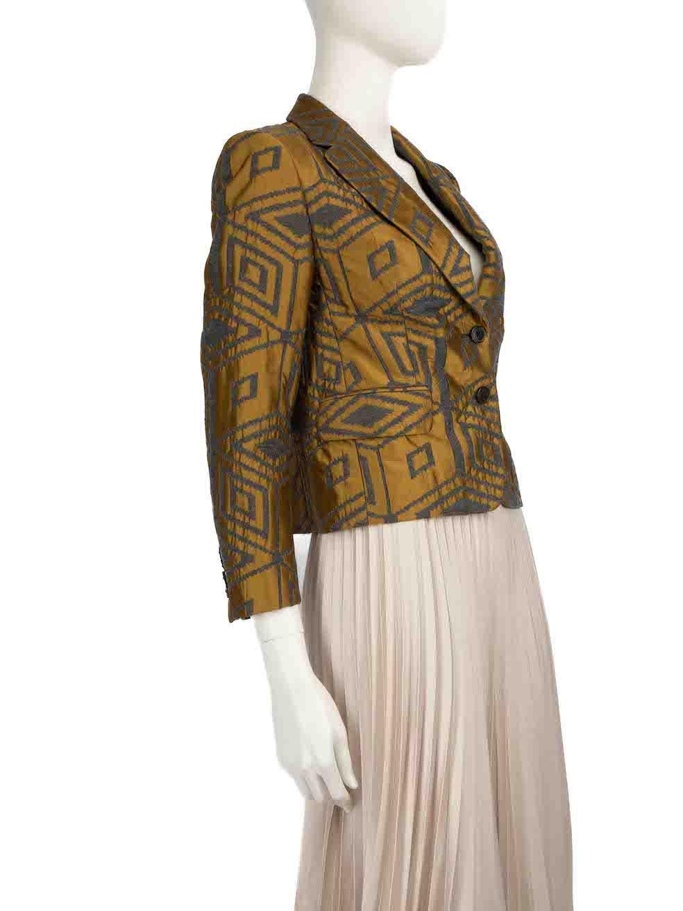CONDITION is Very good. Minimal wear to blazer is evident. Minimal wear to right sleeve with plucks to the jacquard on this used Dries Van Noten designer resale item.
 
 
 
 Details
 
 
 Khaki
 
 Wool
 
 Short length blazer
 
 Abstract jacquard