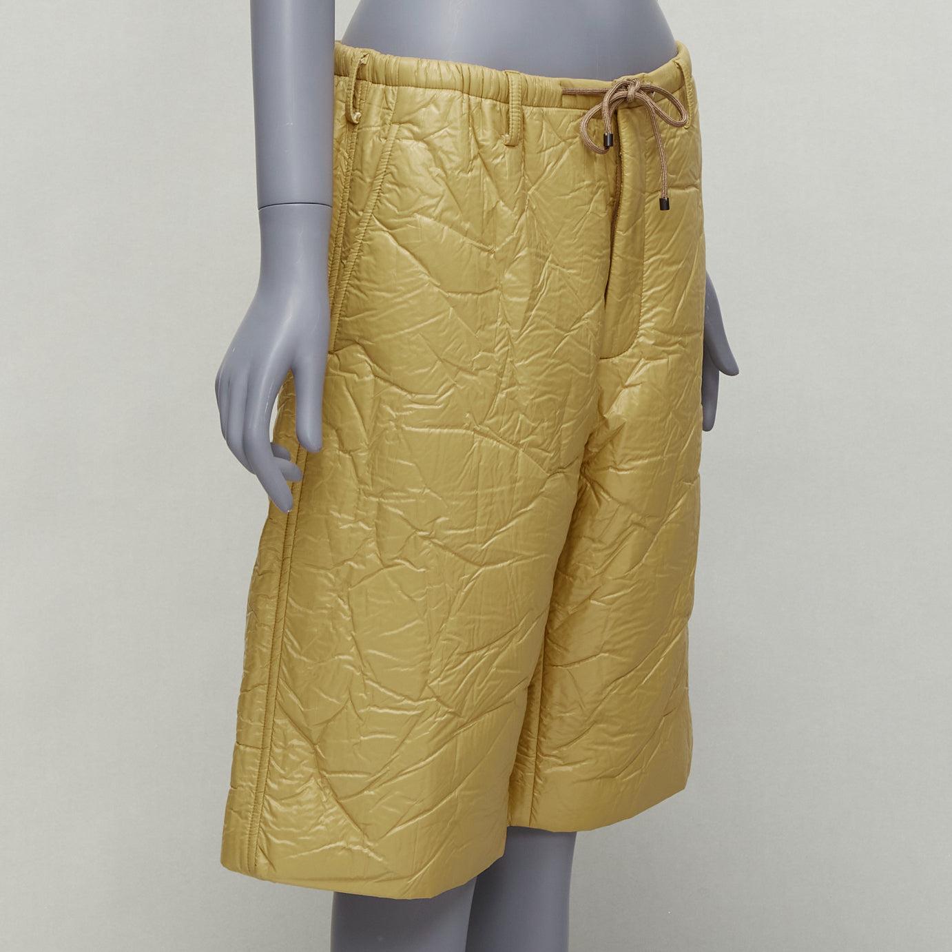 DRIES VAN NOTEN khaki crinkle padded drawstring wide leg half shorts IT46 S
Reference: NKLL/A00054
Brand: Dries Van Noten
Material: Polyester, Blend
Color: Khaki
Pattern: Solid
Closure: Zip Fly
Lining: Khaki
Made in: Bulgaria

CONDITION:
Condition:
