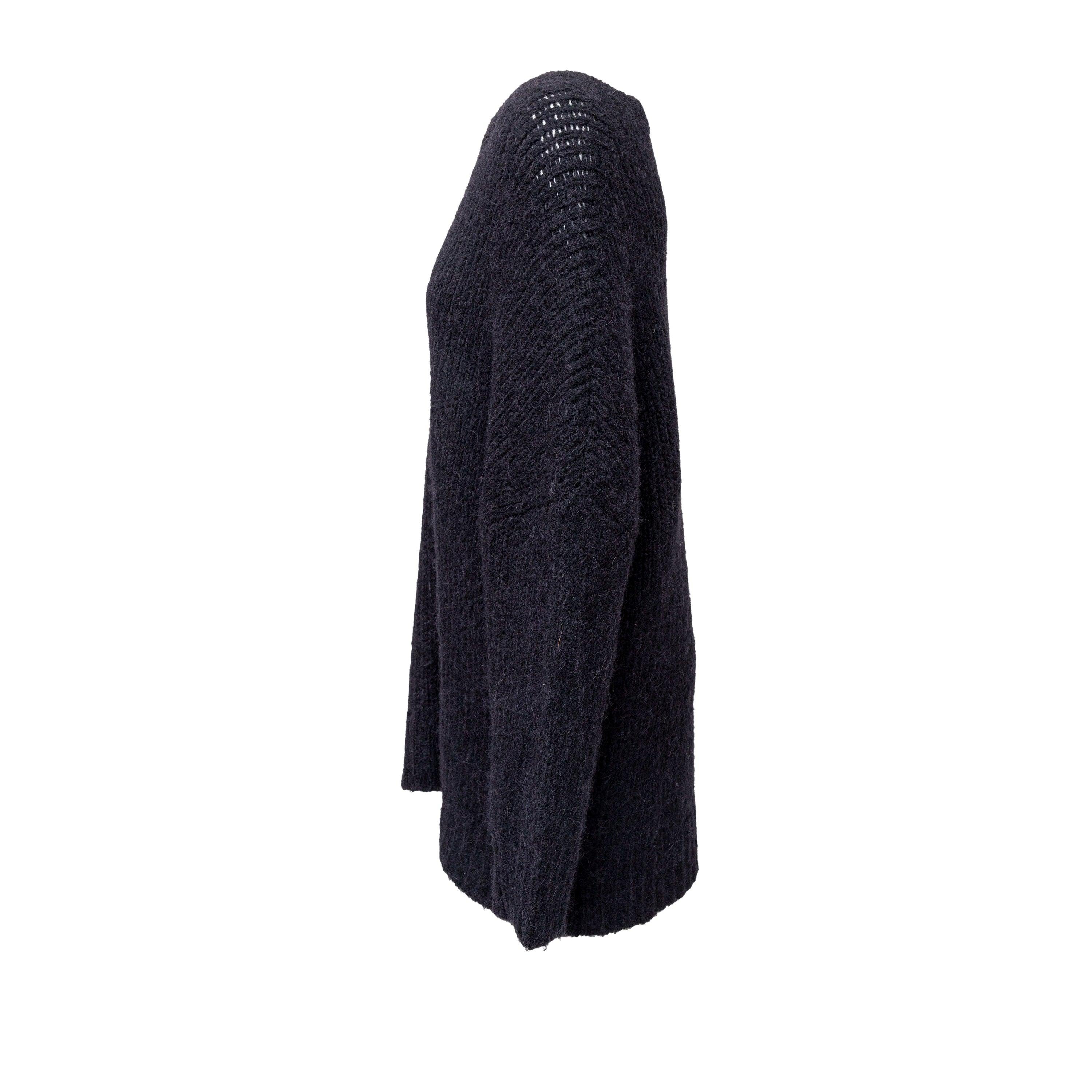 Stay warm and stylish with this Dries Van Noten Knit Sweater. Made of a soft and warm alpaca wool blend, this long sweater features a relaxed neckline and dropped shoulders for a comfortable fit. The ribbed hem adds a touch of texture to this