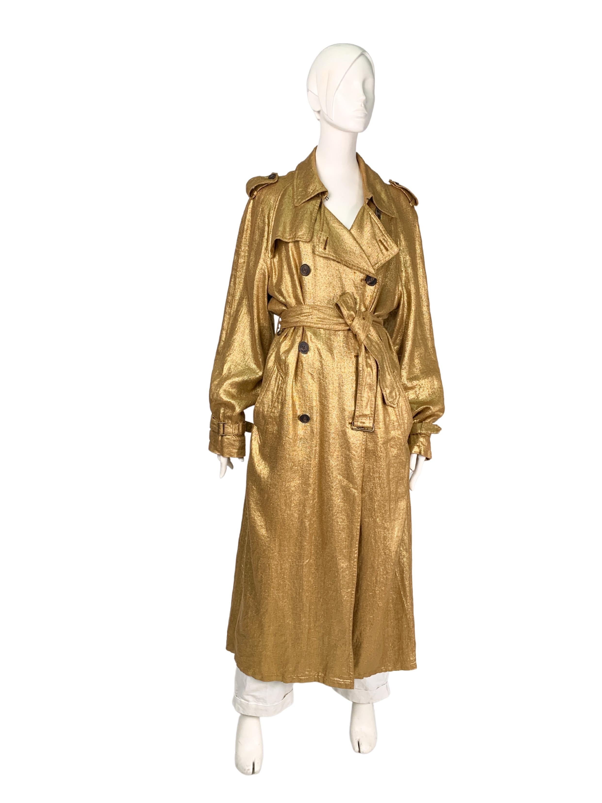 Dries Van Noten metallic gold long double-breasted belted trench coat in 100% linen. The material has a pronounced rough texture, which, combined with metallic gold coating,  creates an interesting effect and adds a casual touch to the garment. Both