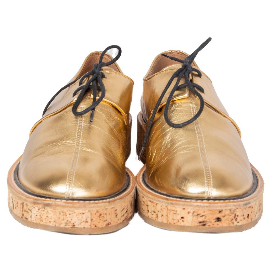 100% authentic Dries Van Noten derbies in metallic gold-tone calfskin featuring a beige cork and rubber sole. Have been worn and are in excellent condition. 

Measurements
Imprinted Size	41
Shoe Size	41
Inside Sole	27cm (10.5in)
Width	8cm