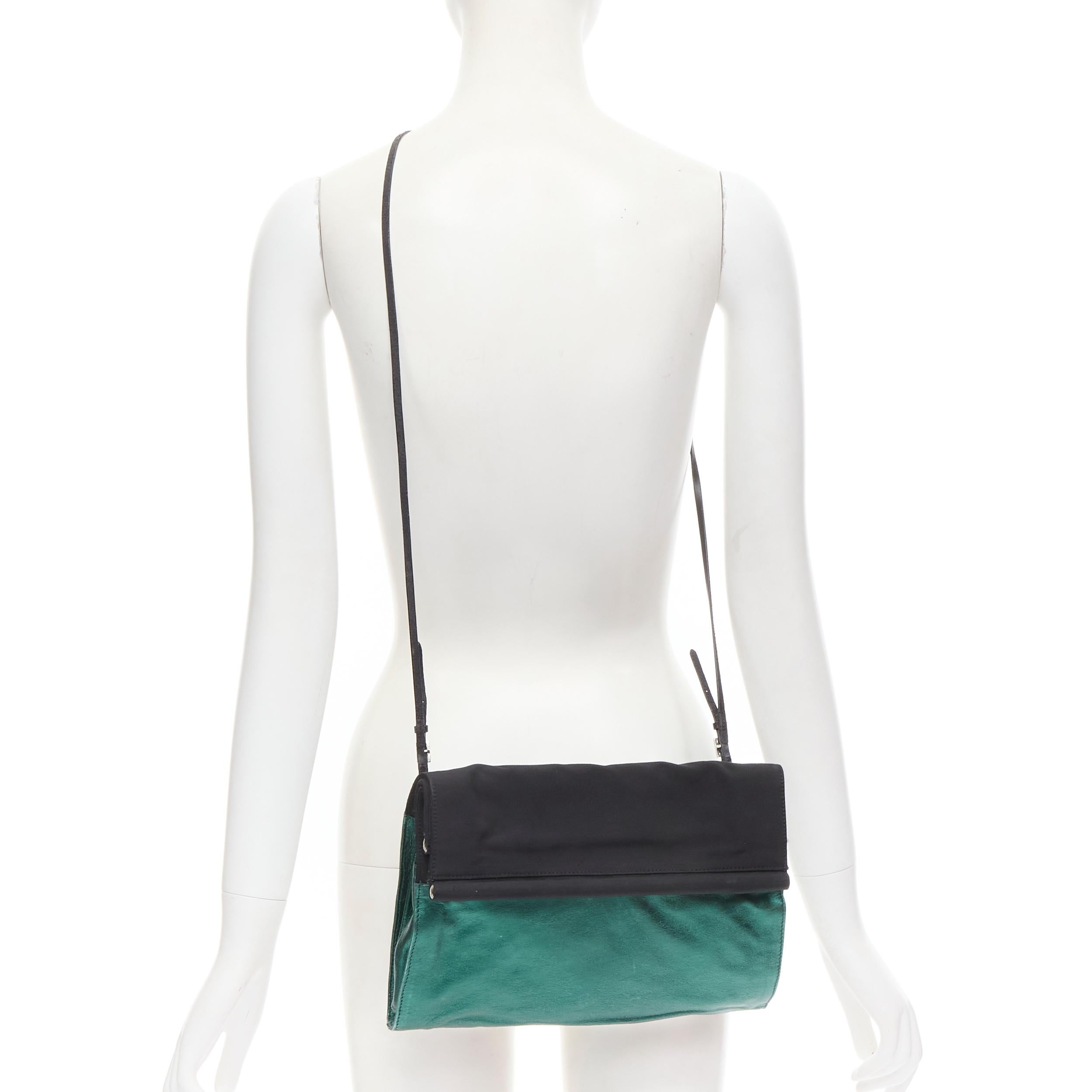DRIES VAN NOTEN metallic green soft leather black foldover crossbody clutch bag 
Reference: CELG/A00044 
Brand: Dries Van Noten 
Designer: Dries Van Noten 
Model: Foldover crossbody clutch
Material: Leather 
Color: Green 
Pattern: Solid 
Closure: