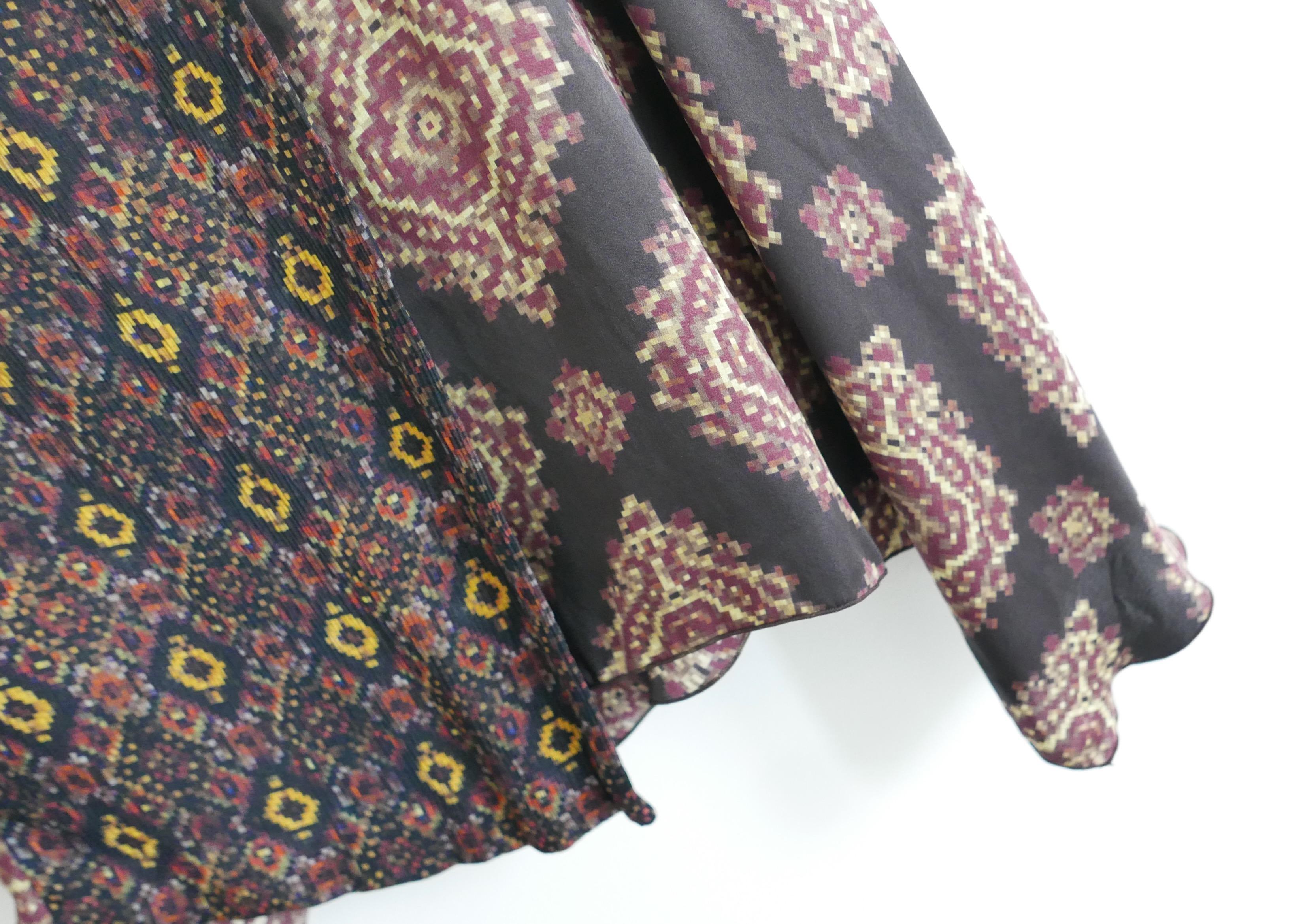 Dries Van Noten mixed Stunning Dries Van Noten mixed print silk skirt. Worn once. Made from soft contrast printed silk, it has a wrap waist with crystal button and asymmetric hem. Size FR40/UK12. Measures approx - waist 32”, hips 38” and length 33”. 