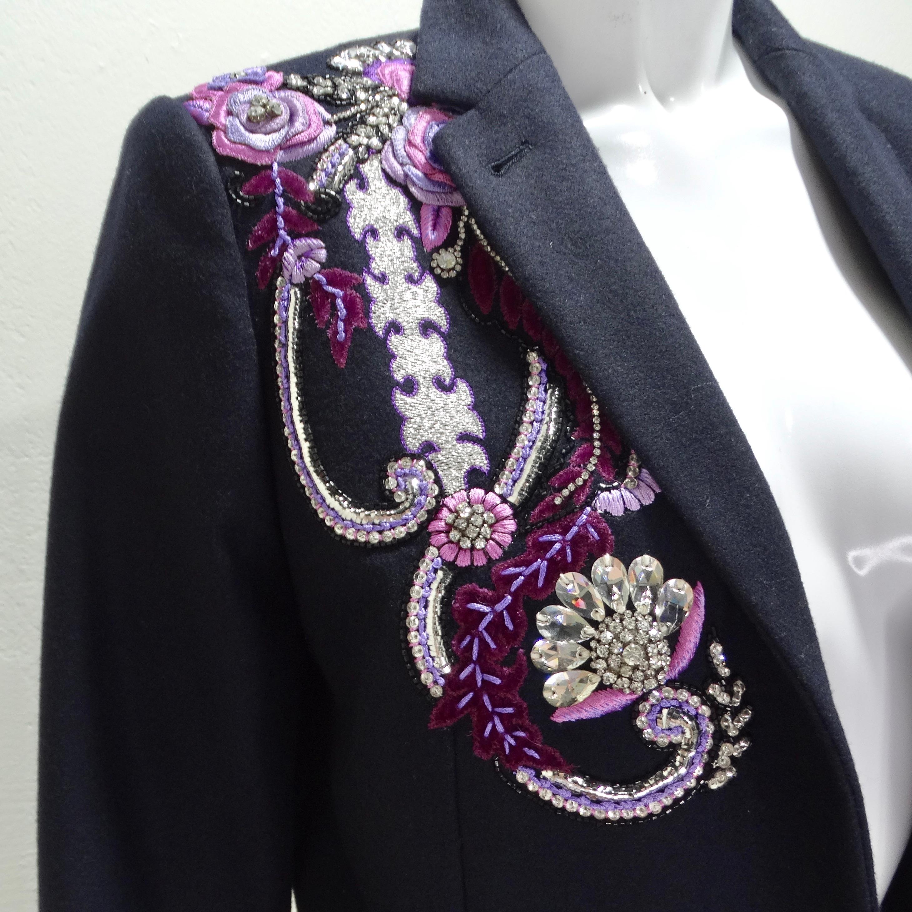 Introducing the exquisite Dries Van Noten Navy Crystal Embroidered Blazer, a timeless and luxurious piece that exudes sophistication and style. Crafted from classic navy fabric, this blazer features a whimsical paisley embroidery on the right