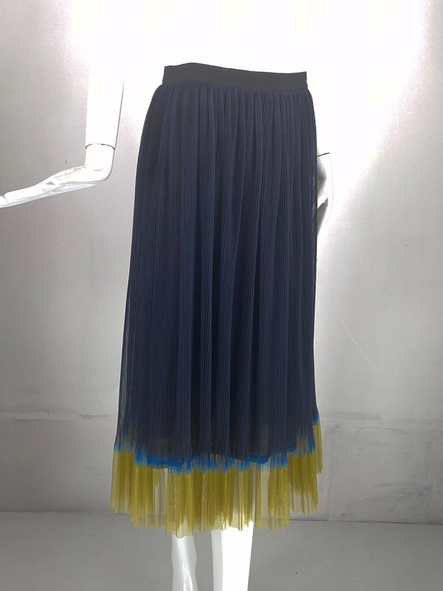 Dries Van Noten navy pinch pleated ombre hem mesh skirt. Black grosgrain waist band skirt of navy mesh that is pinch pleated the lower hem is ombre dyed in shades of blue and mustard yellow. Lined in navy silk. Closes at the back with a zipper and
