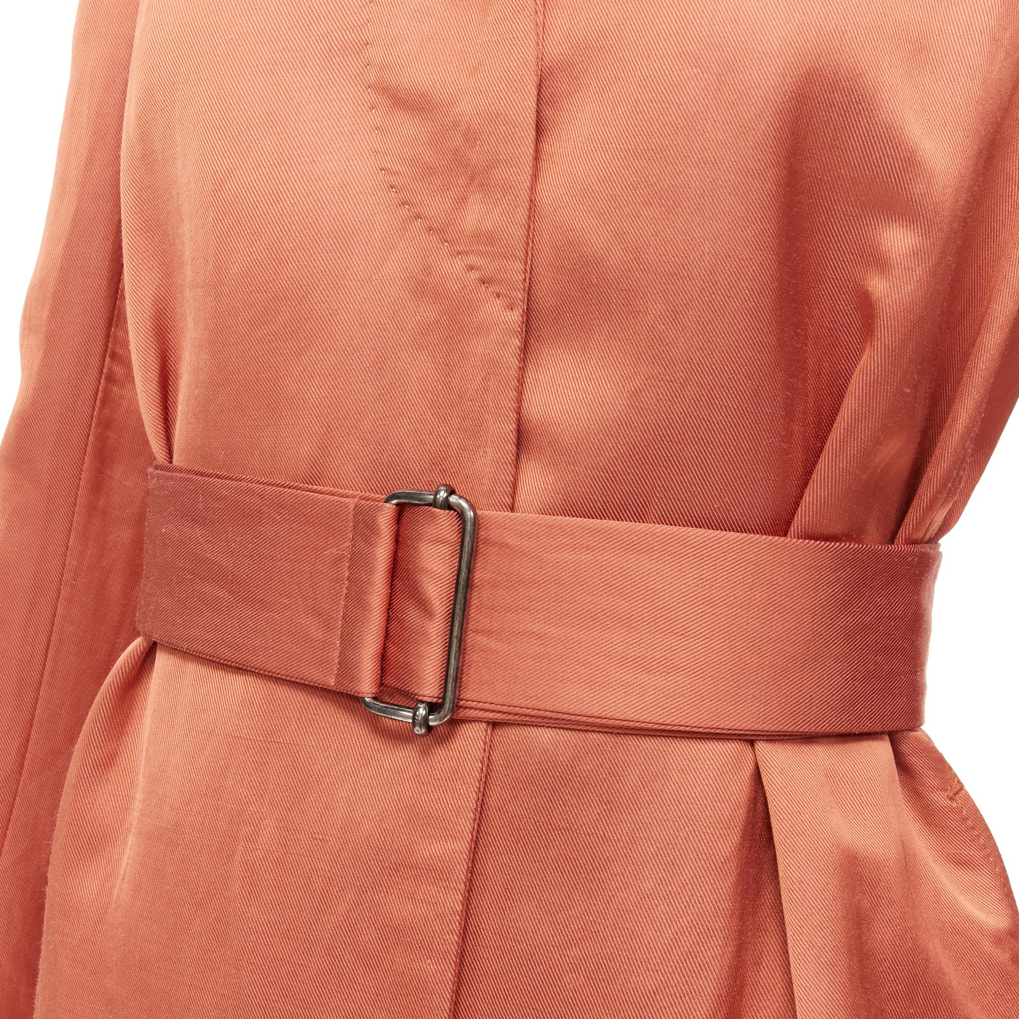 DRIES VAN NOTEN orange ramie rayon elasticated ruched hem belted trench coat S 
Reference: CELG/A00156 
Brand: Dries Van Noten 
Designer: Dries Van Noten 
Material: Ramie 
Color: Orange 
Pattern: Solid 
Closure: Button 
Extra Detail: Snap button at