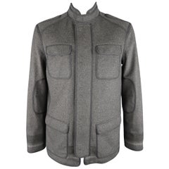 DRIES VAN NOTEN parka comes in black water proof twill with a high collar, hidde