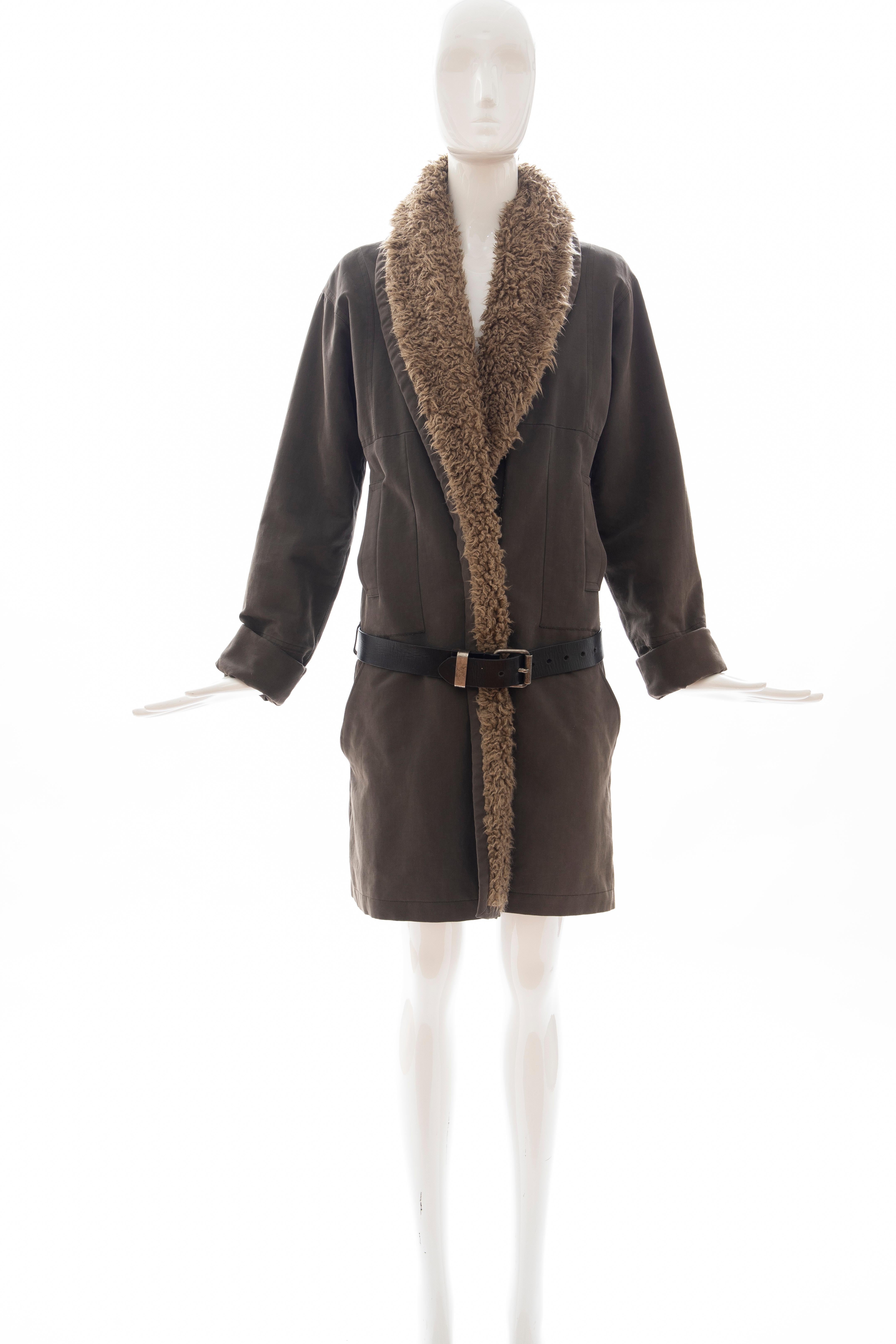 Dries Van Noten, Runway Fall 2002 cotton button front coat featuring shawl lapels, dual pockets, leather belt closure at waist and fully lined.

EU. Small

Bust: 41