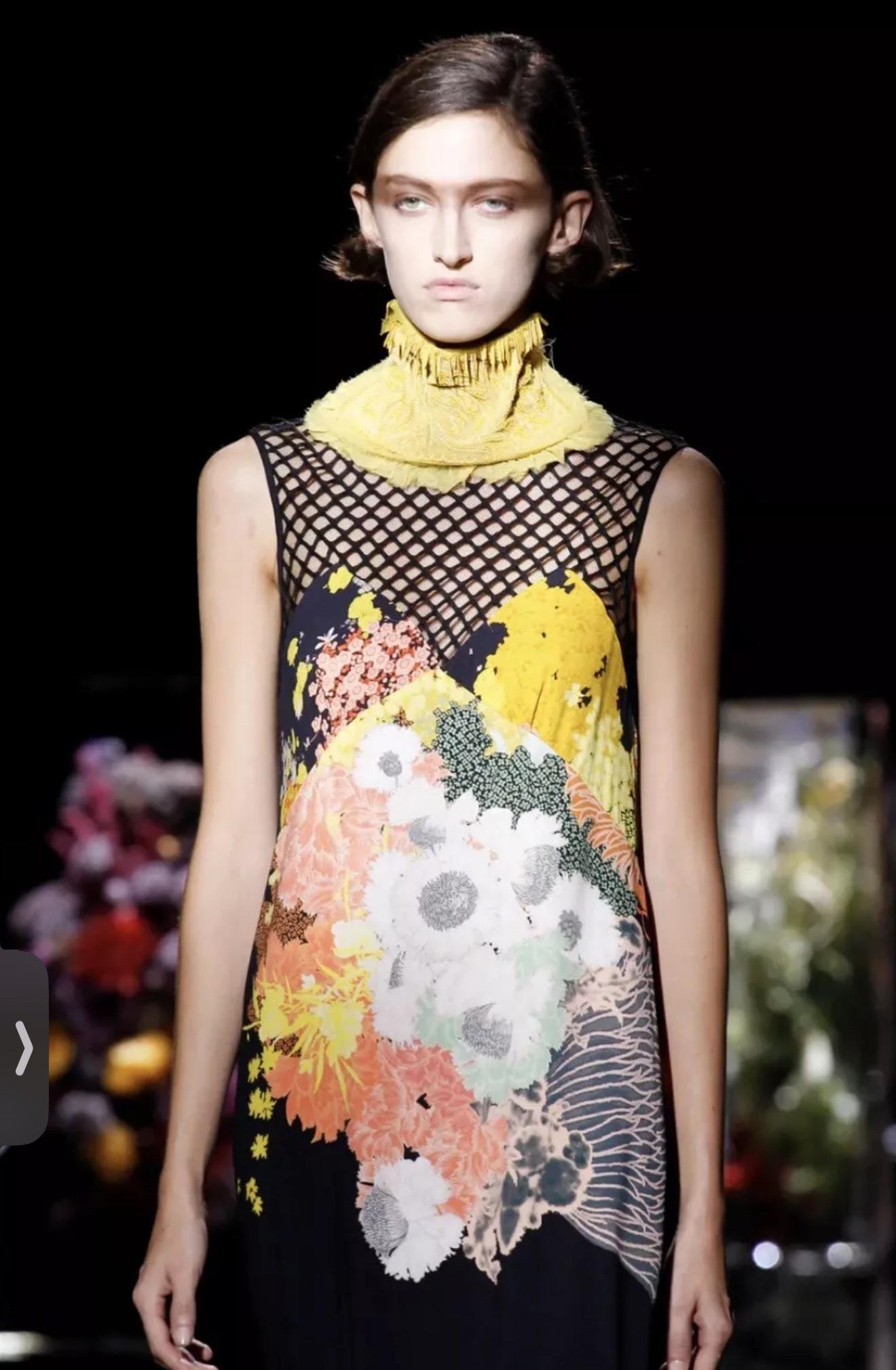 A stunning piece from Dries Van Noten’s Spring 2017 runway collection—a season celebrated for its bold contrasts, layered textures, and moody florals. This sleeveless midi dress blends graphic and organic elements in signature Van Noten style.

•