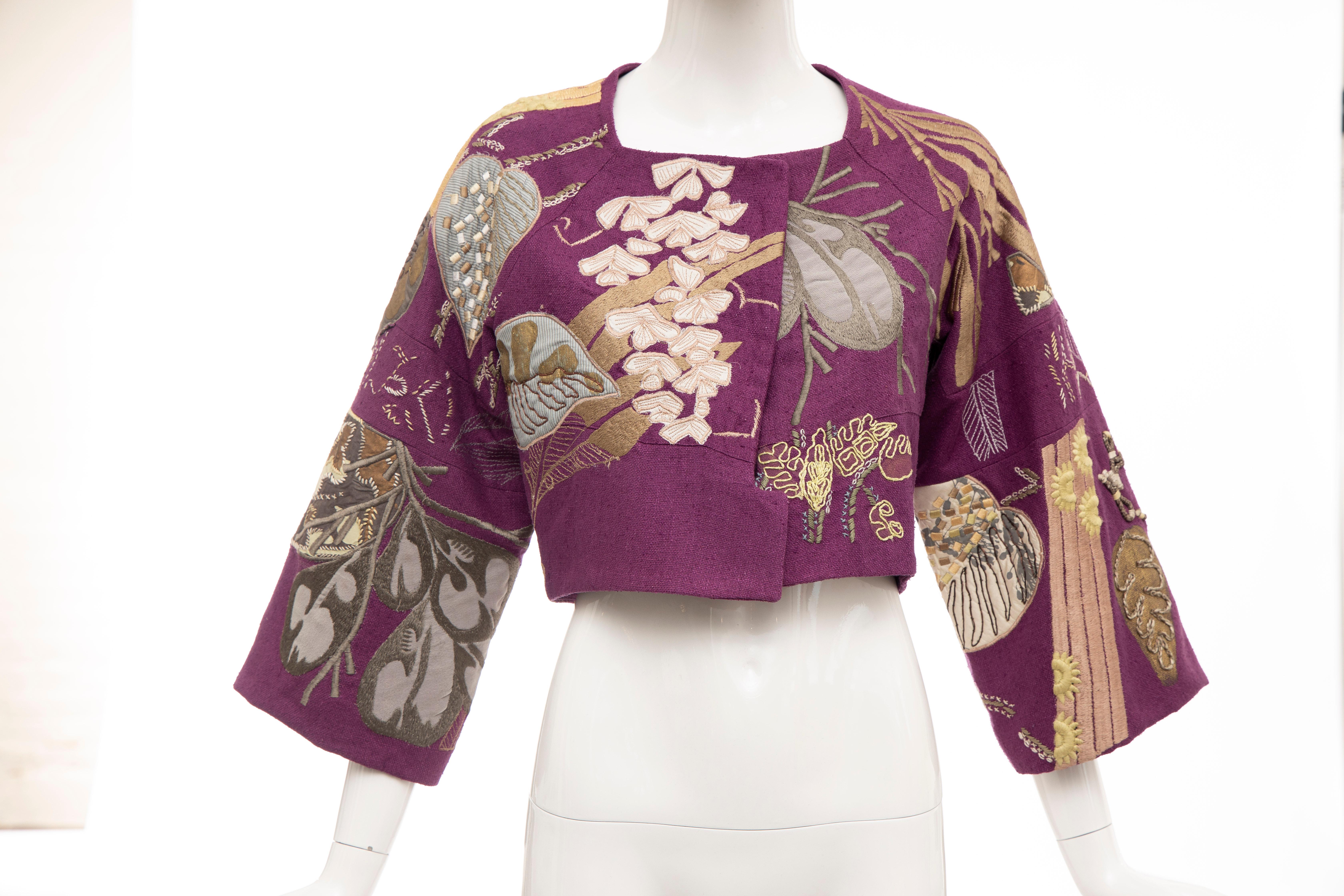 Dries Van Noten Runway Spring 2006, silk magenta embroidered jacket, square neck, kimono sleeves, cropped fit and single hook closure at front.

Size: 36

Bust: 32