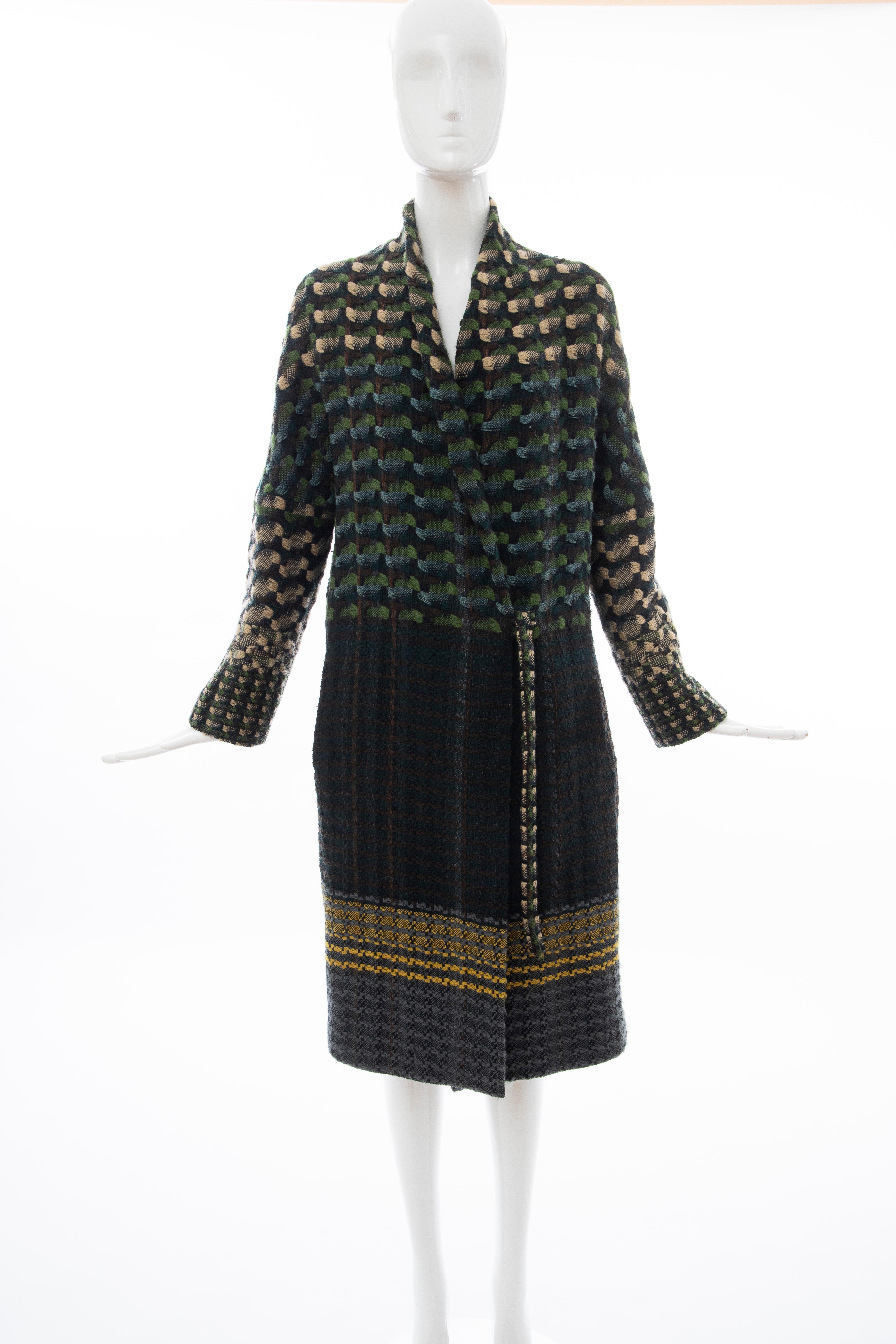 Dries van Noten, Runway Fall 2004, wool plain weave tweed coat with two front pockets, drawstring closure at front. and fully lined.

Large

Bust: 42,, Waist: 42, Shoulder: 16, Length: 42, Sleeve: 24

Fabric: 100% Wool fully lined