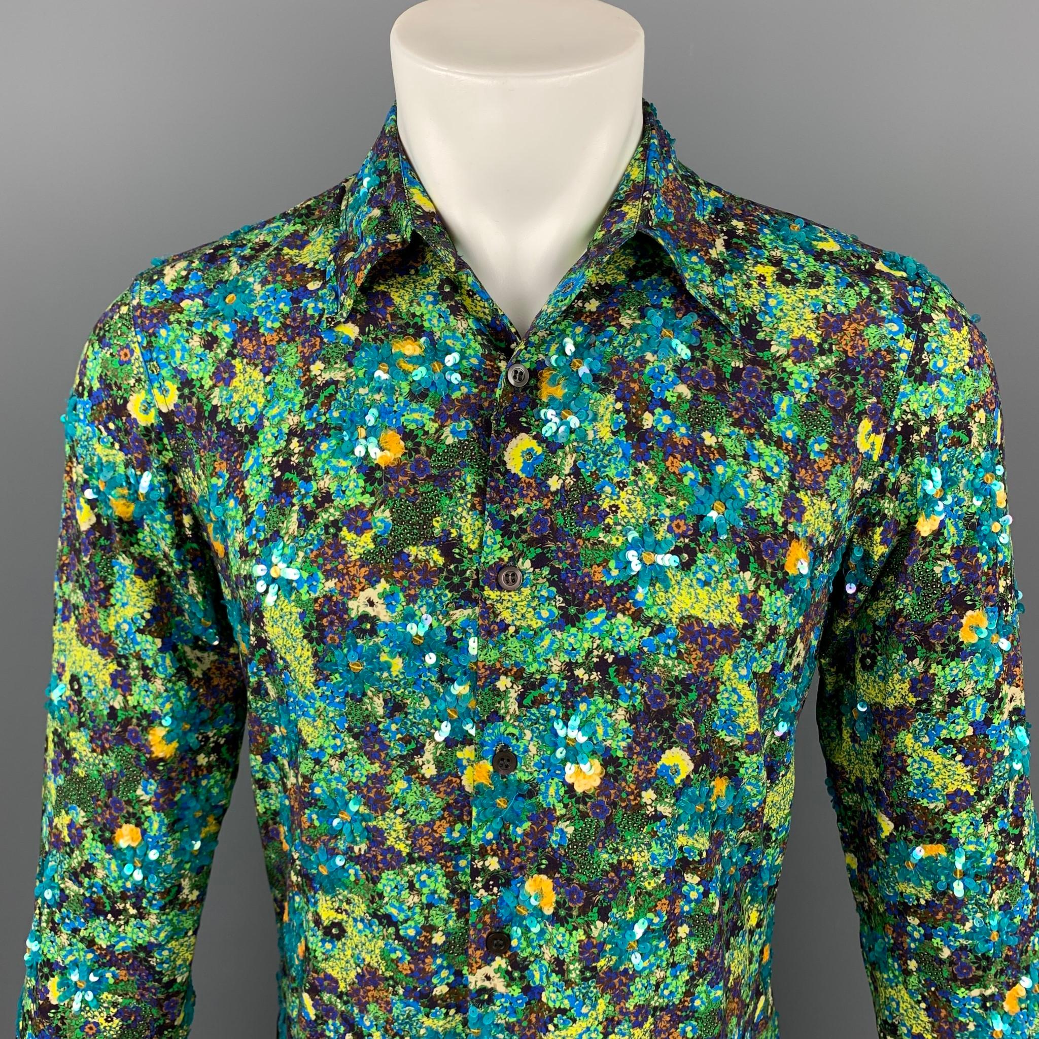 DRIES VAN NOTEN long sleeve shirt comes in a green & blue print viscose with floral sequin details featuring a button up style and a spread collar.

New With Tags. 
Marked: 46
Original Retail Price: $820.00

Measurements:

Shoulder: 17 in.
Chest: 36