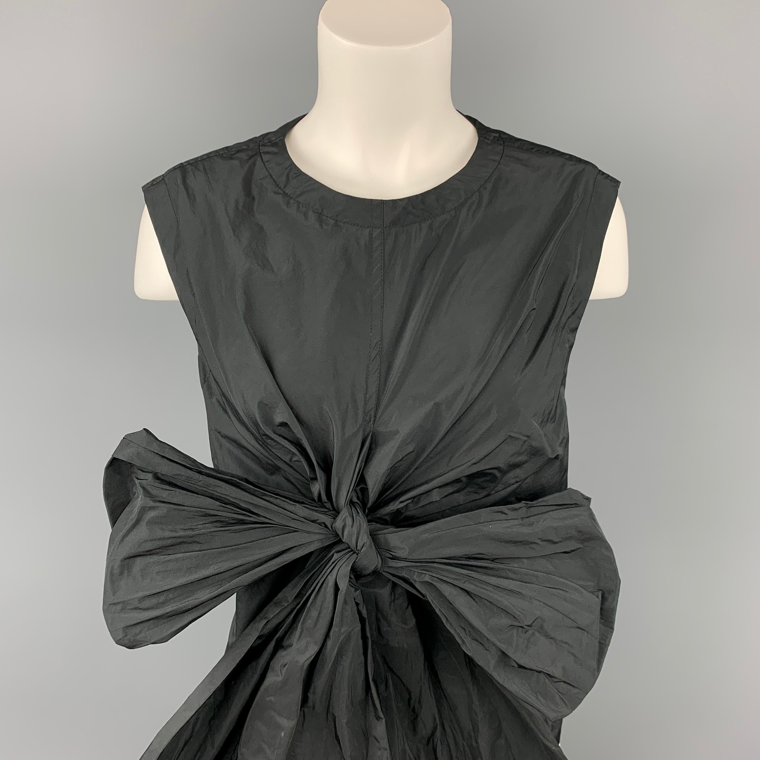 DRIES VAN NOTEN dress top comes in a black tafeta polyester featuring a oversized bow design, sleeveless, and a back zip up closure. Made in Belgium.

Very Good Pre-Owned Condition.
Marked: 40

Measurements:

Shoulder: 16.5 in.
Bust: 38 in.
Length: