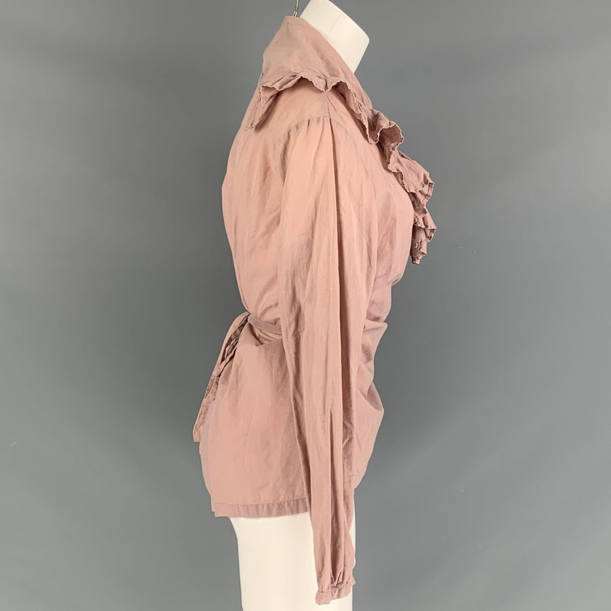 DRIES VAN NOTEN long sleeves blouse comes in a dust pink fabric featuring v-neck, ruffled detail at the collar and wrap up style. Made in Belgium.Excellent Pre-Owned Condition. Fabric tags removed. 

Marked:   42 

Measurements: 
 
Shoulder: 17