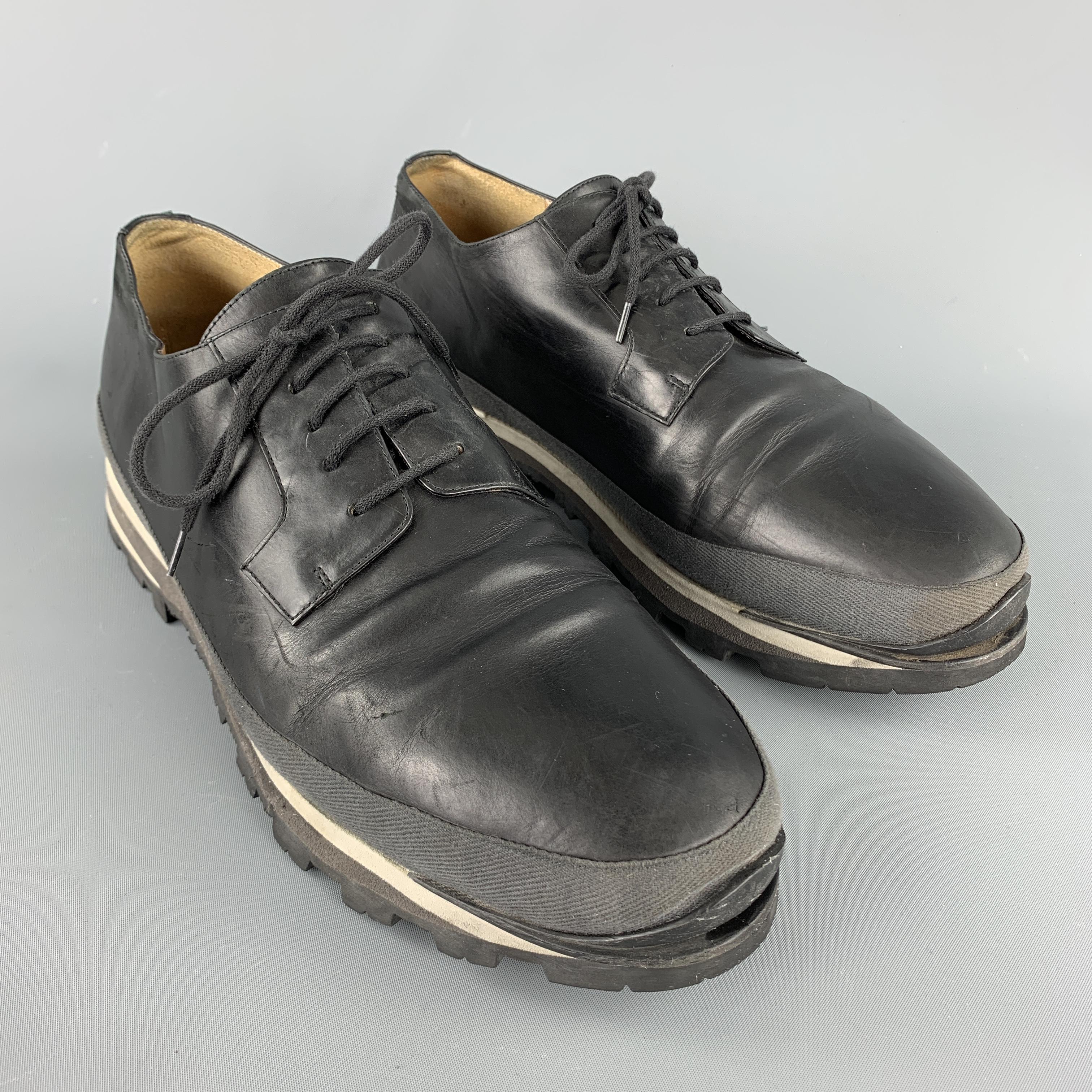DRIES VAN NOTEN lace up shoes comes in a black solid leather material, with a grey trim, a contrast trim, and a track sole. Made in Italy.

Good Pre-Owned Condition.
Marked: IT 44   14833

Outsole: 12.5 x 4 in. 