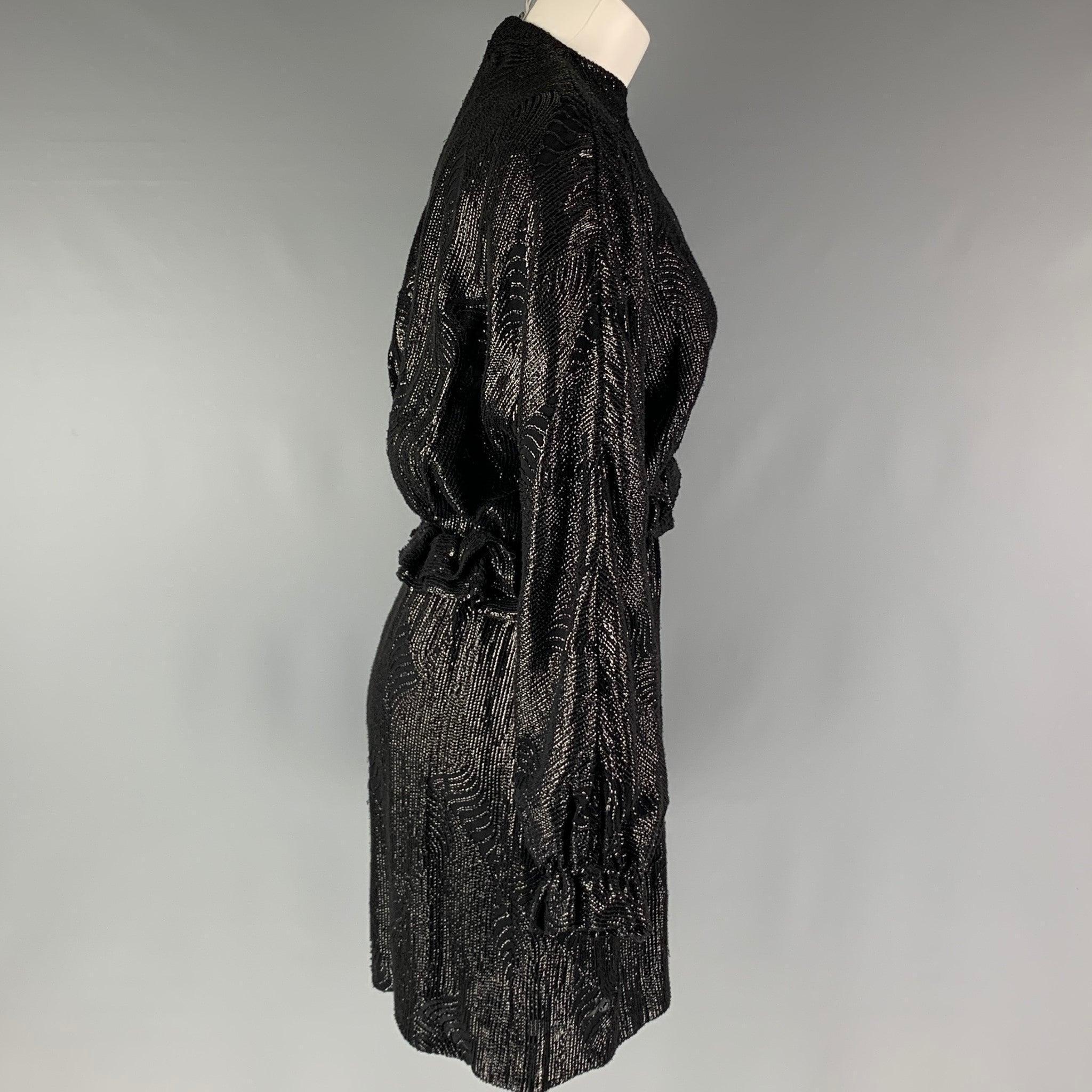 DRIES VAN NOTEN long sleeve dress comes in a black viscose woven material featuring a black sequins throughout, drop shoulder, ruffled detail at the waistband, elastic waistband and zip up closure. Very Good Pre-Owned Condition. Minor signs of wear.