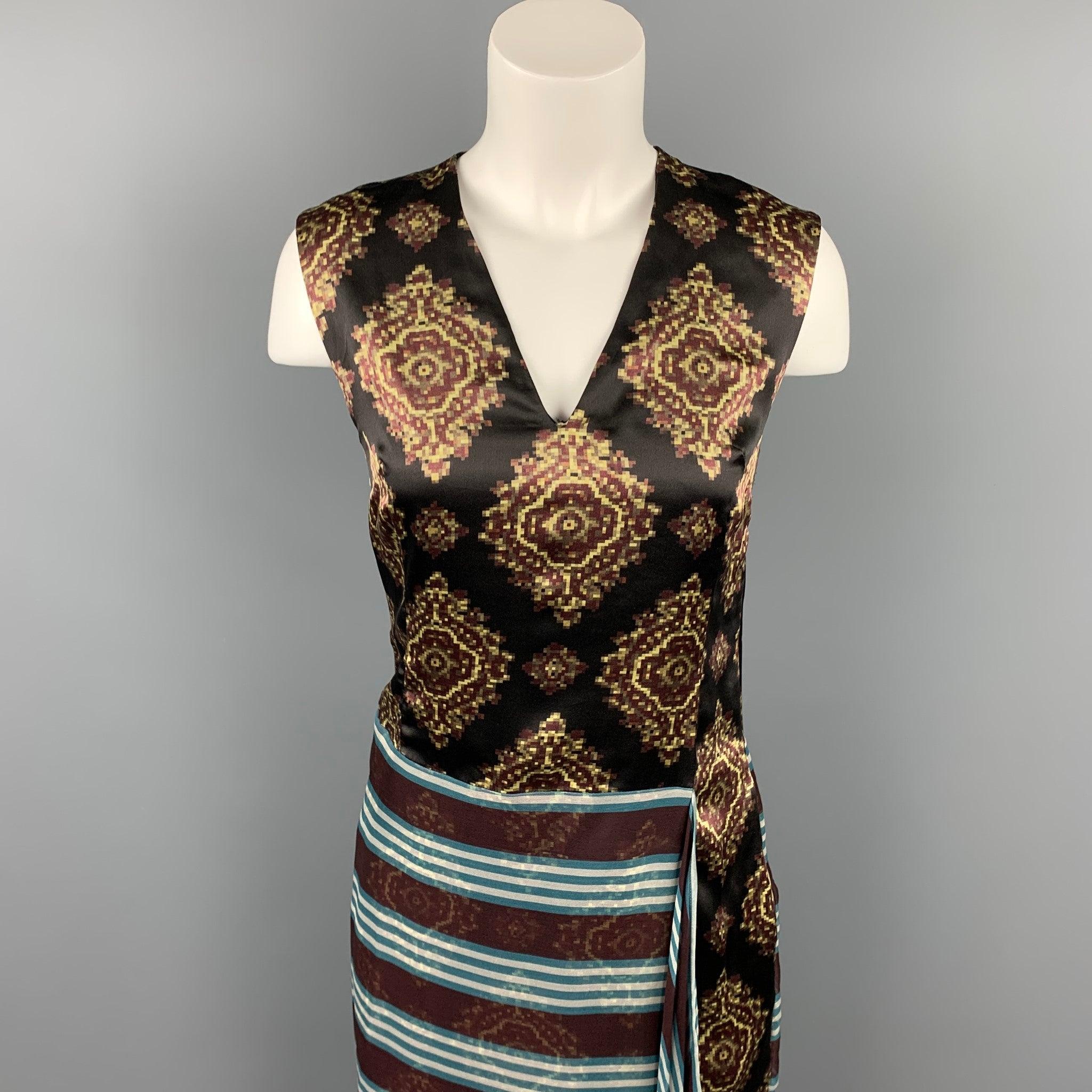 DRIES VAN NOTEN dress comes in a multi-color patchwork silk with a slip liner featuring a shift style, front see through layer, v-neck, and a side zipper closure. Made in Belgium.Very Good
Pre-Owned Condition. 

Marked:   34 

Measurements: 
  Bust: