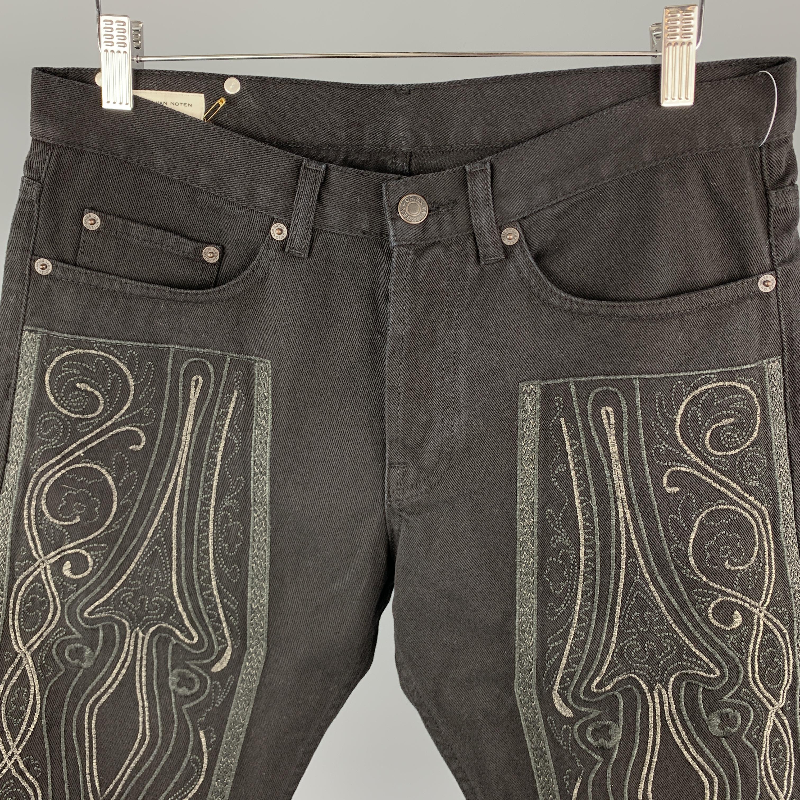 DRIES VAN NOTEN Shorts comes in a black tone in a solid denim material, with an embroidery at front, a leather tag, button fly, in a five pockets style. 

Excellent Pre-Owned Condition.
Marked: 31

Measurements:

Waist: 33 in. 
Rise: 9.5 in.
