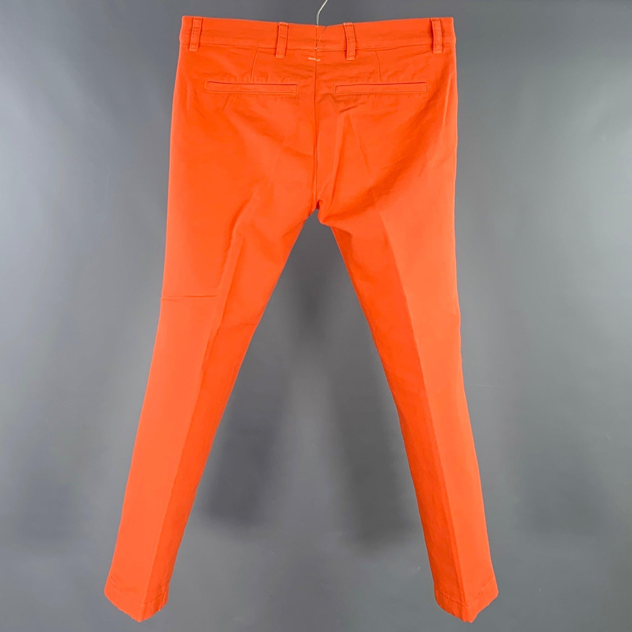 DRIES VAN NOTEN casual pants
in an orange cotton woven fabric featuring a flat front style, four pockets, and zip fly closure.Very Good Pre-Owned Condition. Minor signs of wear on back. 

Marked:   IT 48 

Measurements: 
  Waist: 32 inches Rise: 8.5