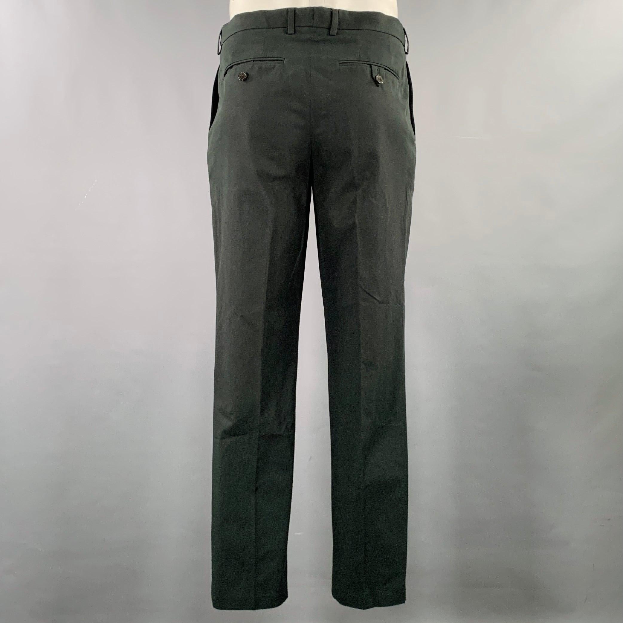 DRIES VAN NOTEN casual pants
in a black cotton woven fabric featuring a flat front style, straight leg, and zip fly closure. Excellent Pre-Owned Condition. 

Marked:   IT 52 

Measurements: 
  Waist: 36 inches Rise: 9.5 inches Inseam: 31 inches 
  
